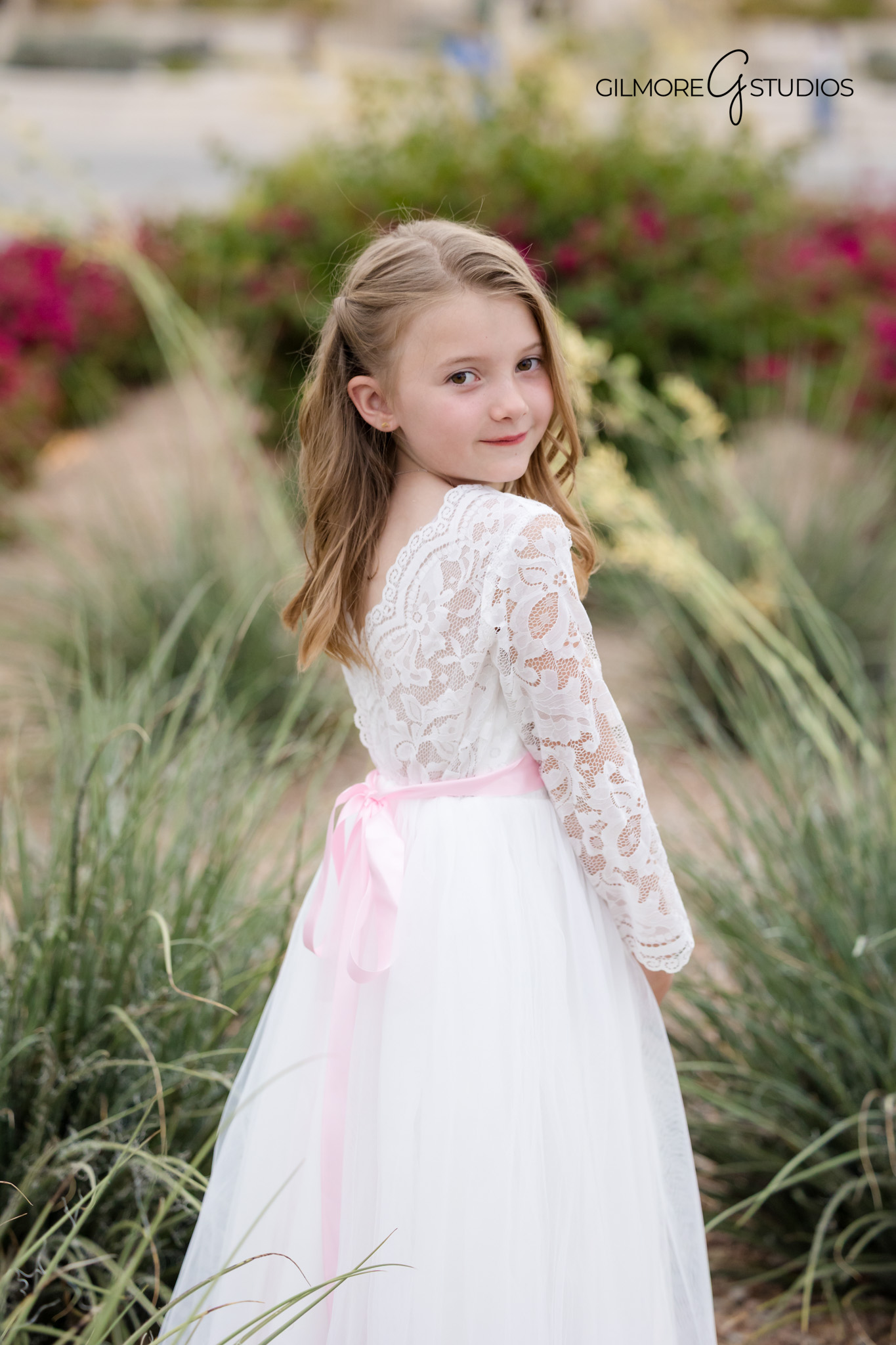 Gilbert AZ baptism portrait photography with child smiling in flower garden
LDS baptism photographer Gilbert Arizona Temple portrait session at sunset