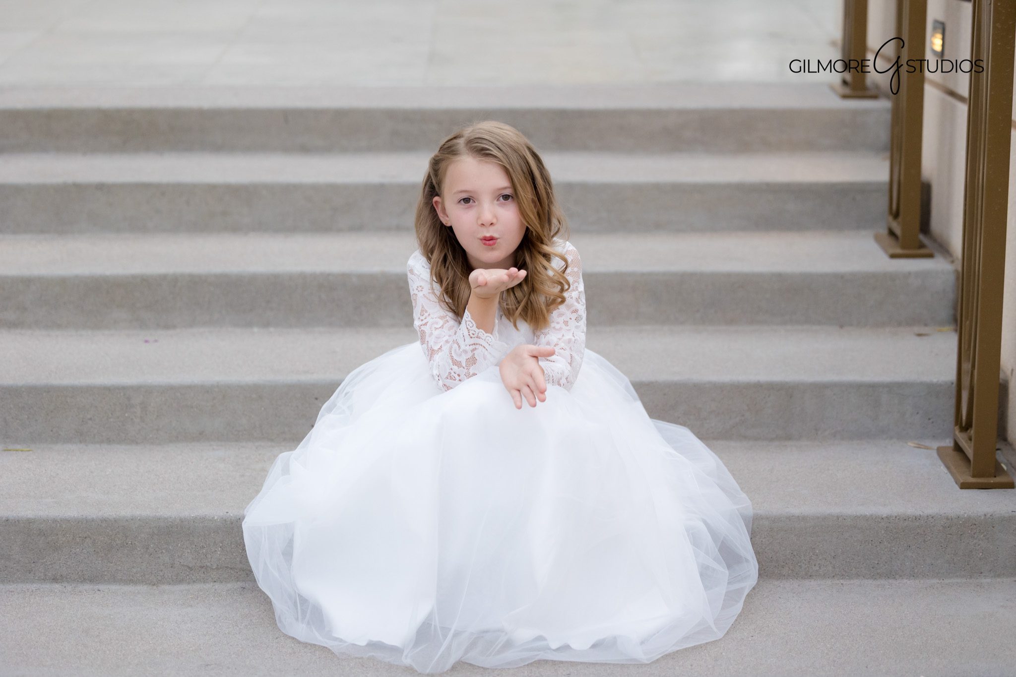 Gilbert temple baptism photography with child standing near fountain
Young LDS baptism portrait session at Gilbert Arizona Temple
