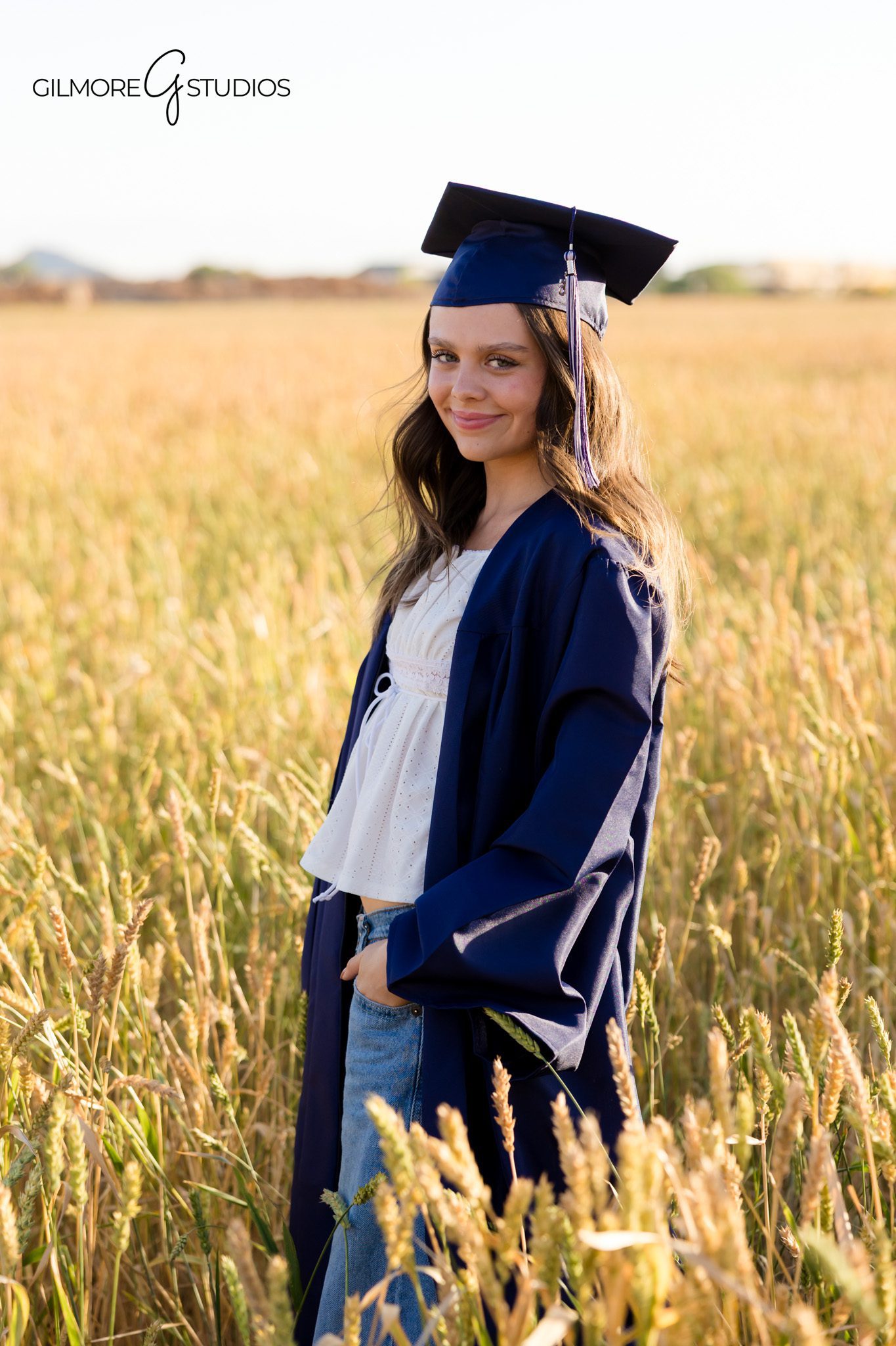 Gilbert Arizona senior girls photographer in wheat field
Queen Creek graduation photographer best friends heart hands pose