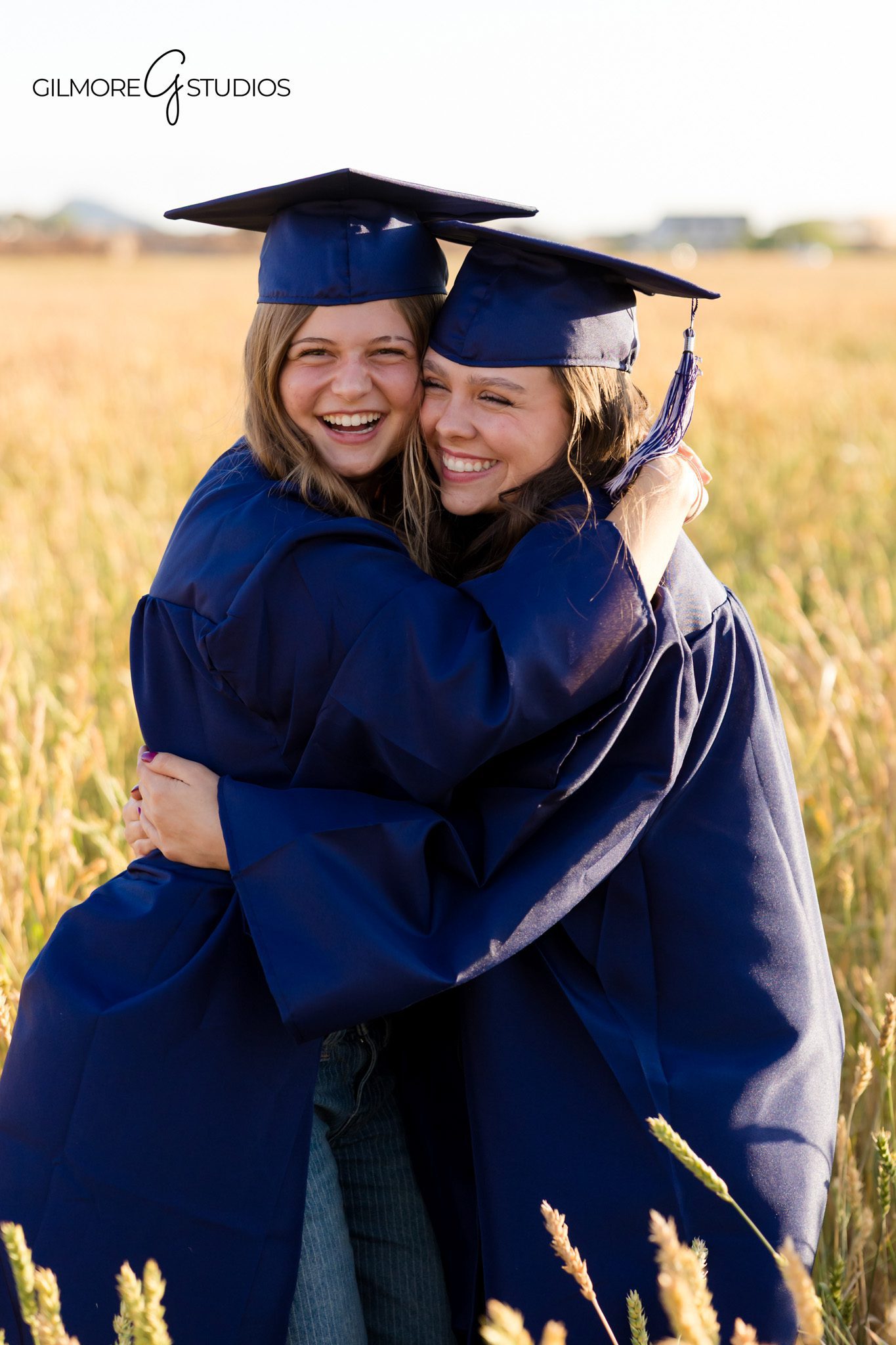Arizona senior girls photography with cap and gown
Queen Creek graduation portraits with best friends laughing