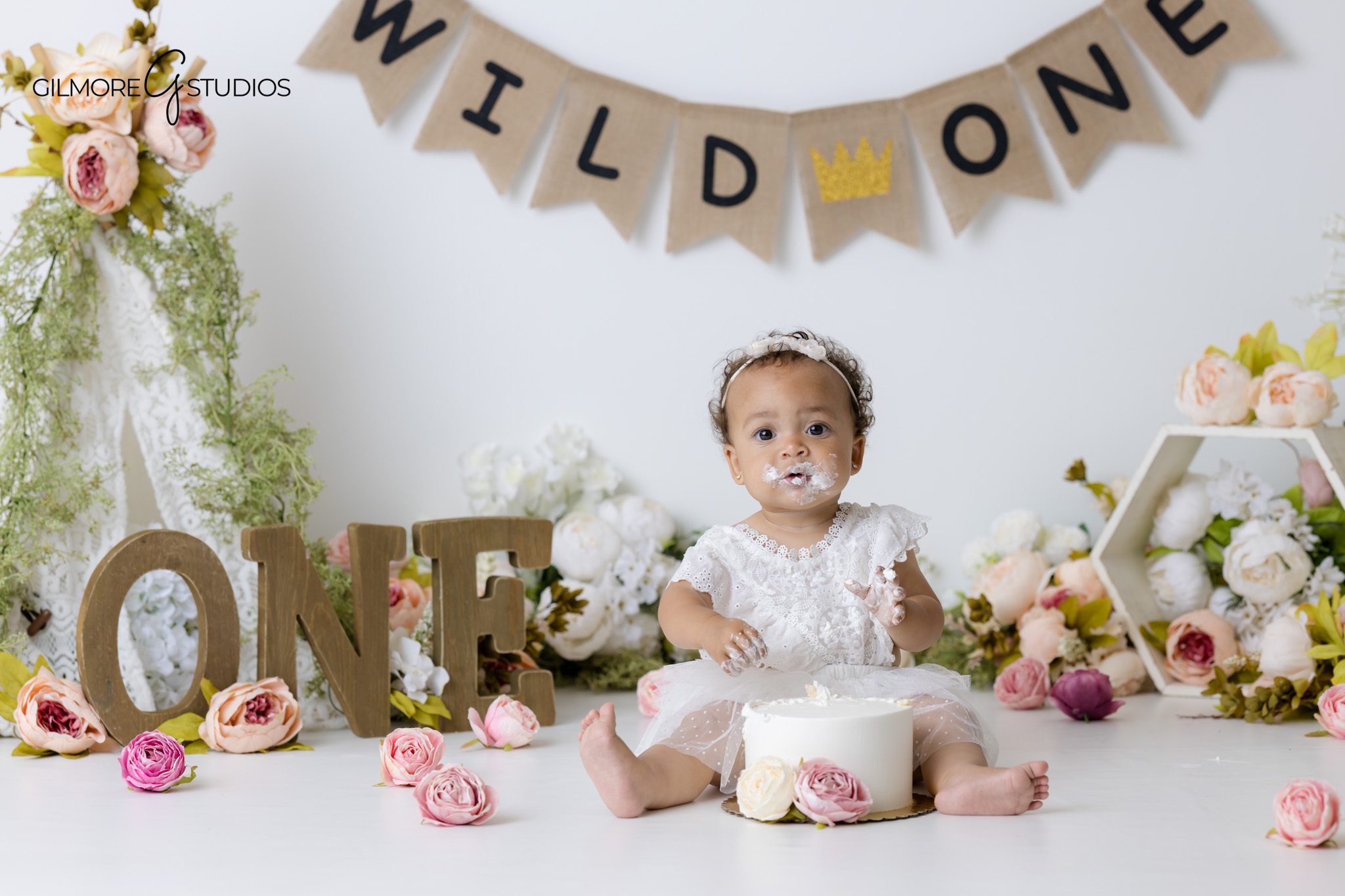 Baby girl first birthday portraits Gilbert Arizona with blush pink floral cake smash theme