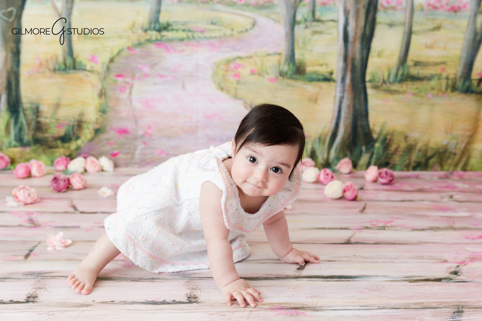 Baby milestone photography in Orange County with soft spring styling
Newport Beach baby portraits with baby sitting on a neutral studio backdrop