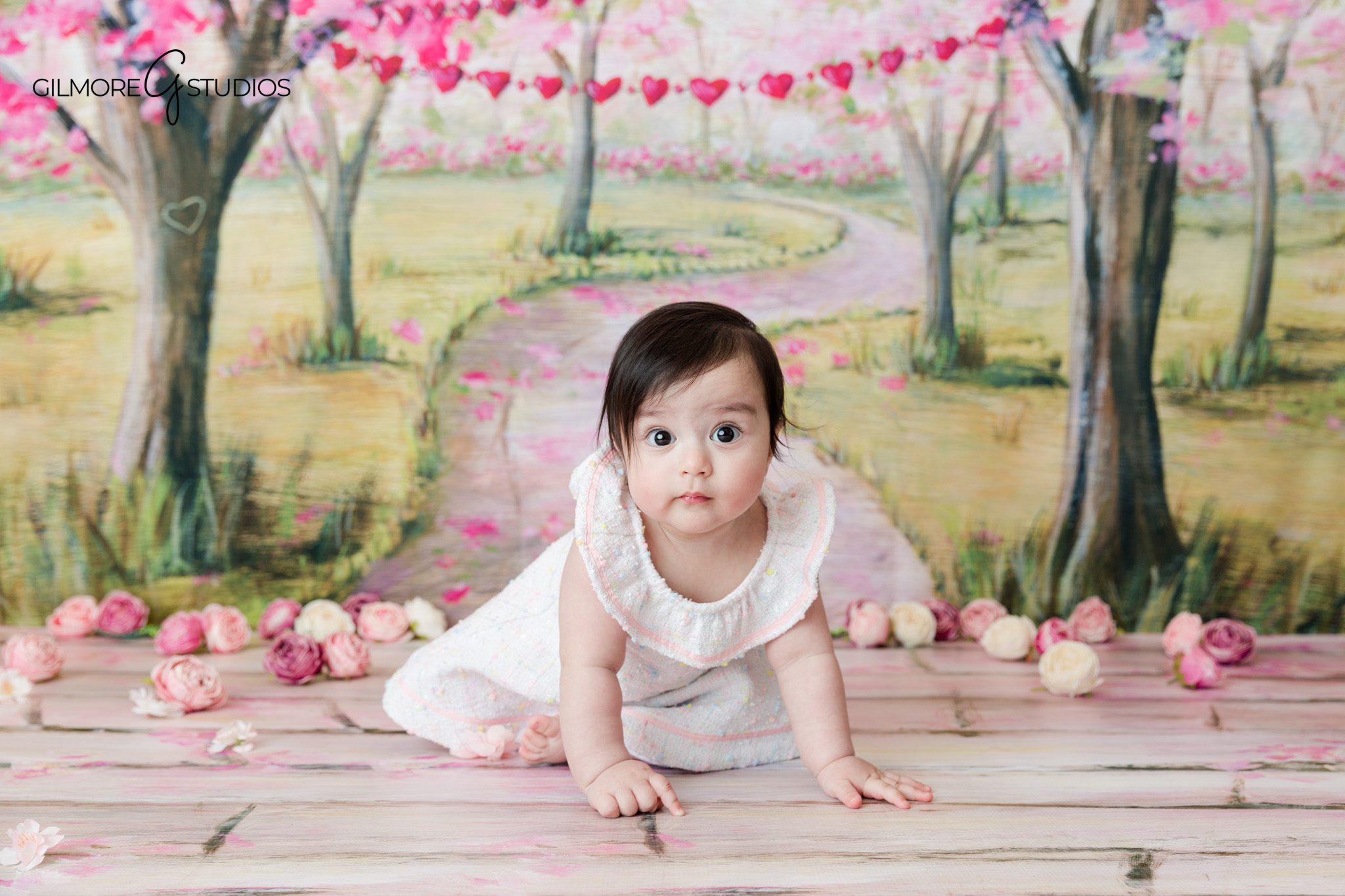 Spring sitter session with baby smiling on a simple studio set
Baby sitting-up portraits photographed in Newport Beach California
