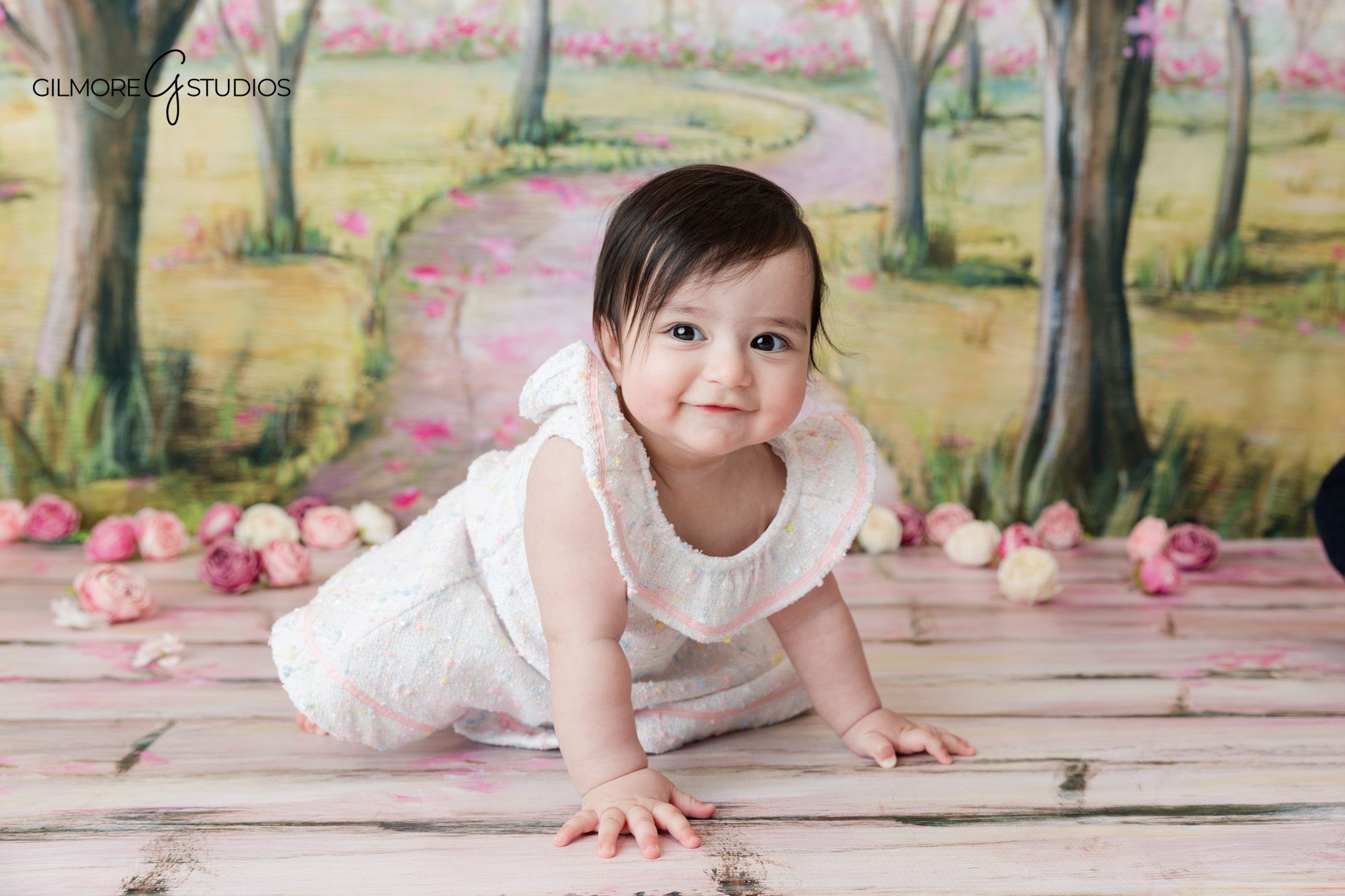 Spring baby milestone session with baby in a cream romper
Newport Beach baby photographer capturing baby’s sitting-up milestone