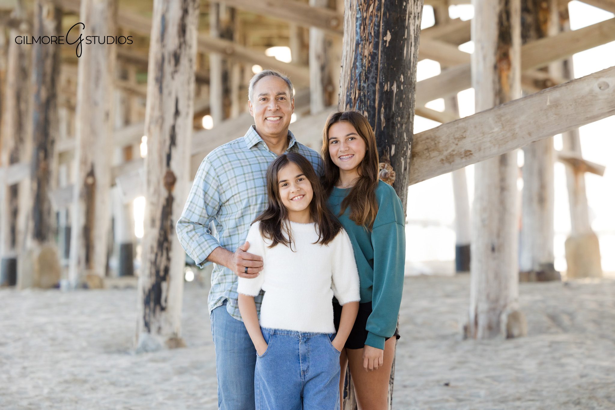 Family portraits at Newport Pier with soft November evening light
Candid parent and child moment during Newport Beach family photos