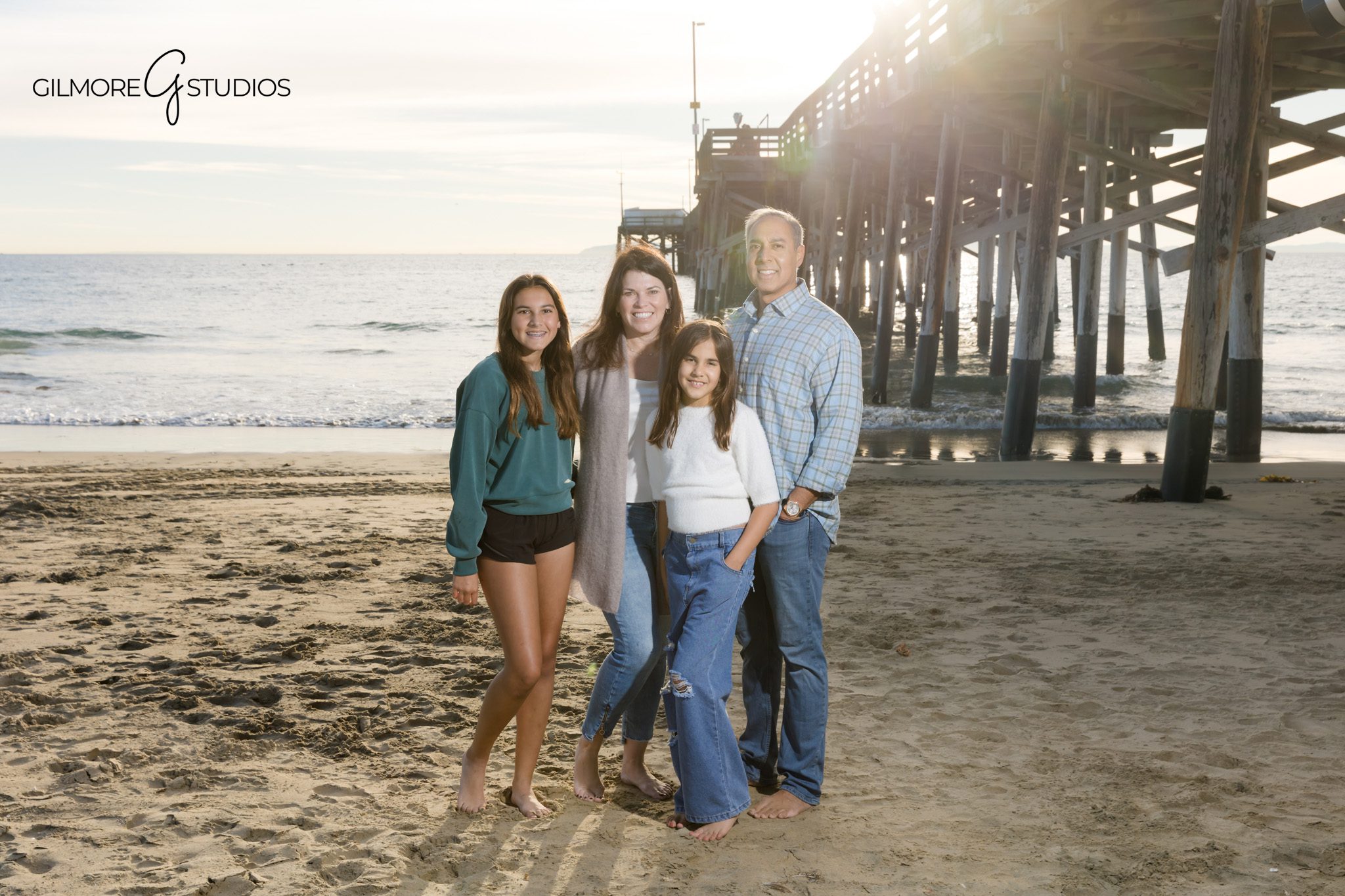 Candid family portraits at Newport Pier during golden hour in Newport Beach
Children playing in the sand during a Newport Beach family photo session
