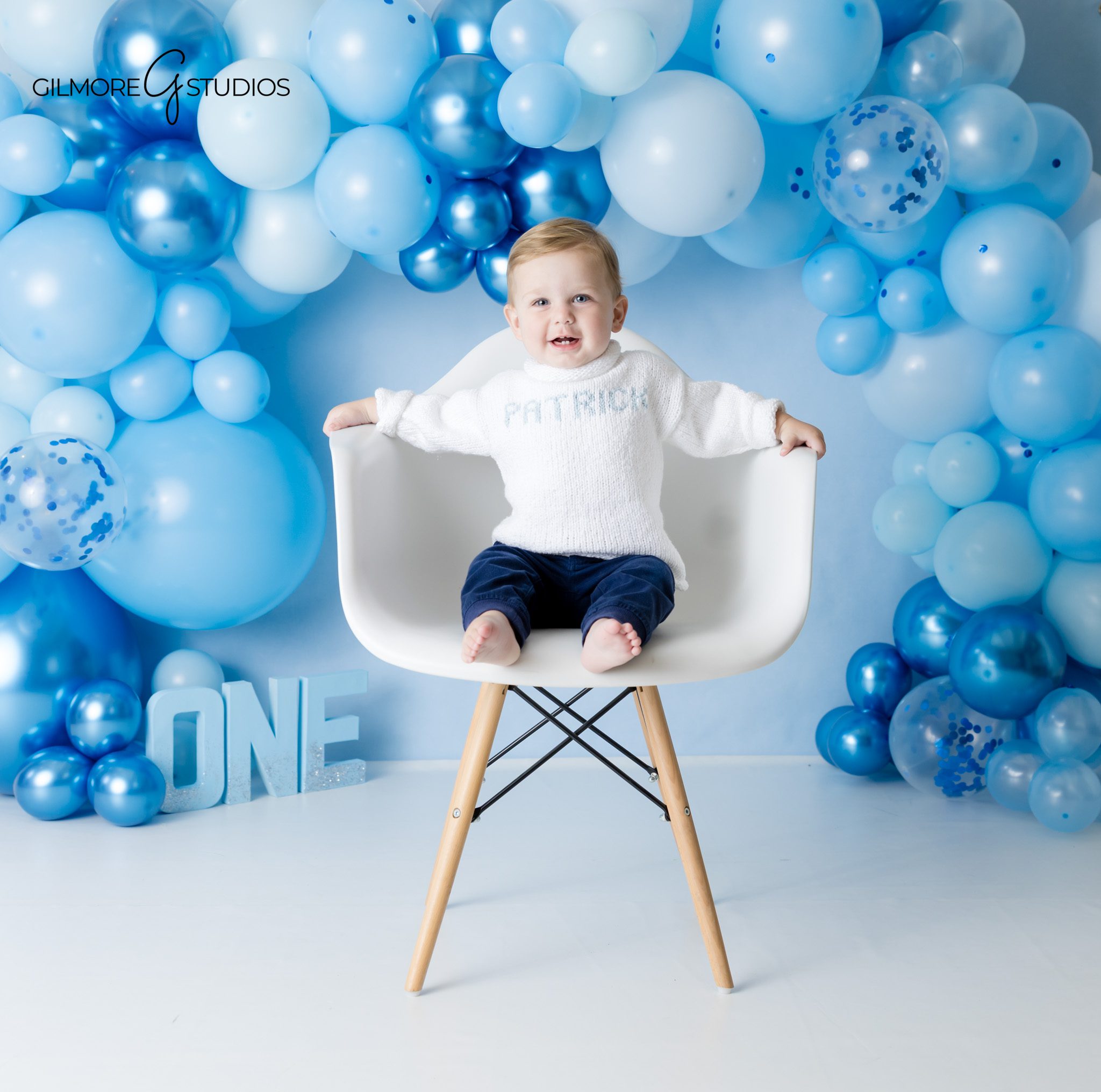 Blue and white birthday setup for baby boy
First birthday cake smash session Arizona studio
