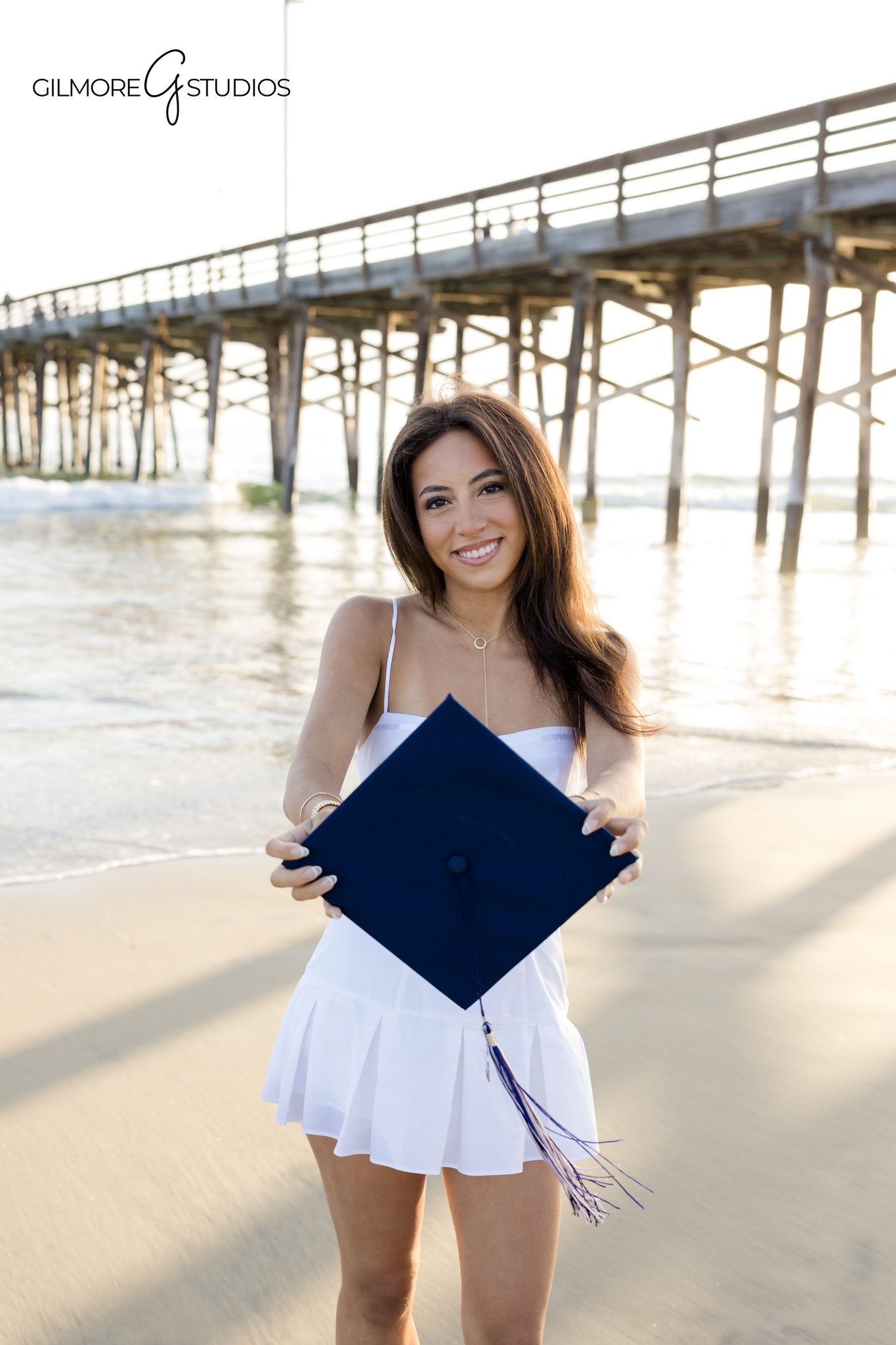 Newport Beach senior girl photographer session
Senior portraits with college pennant Newport Beach