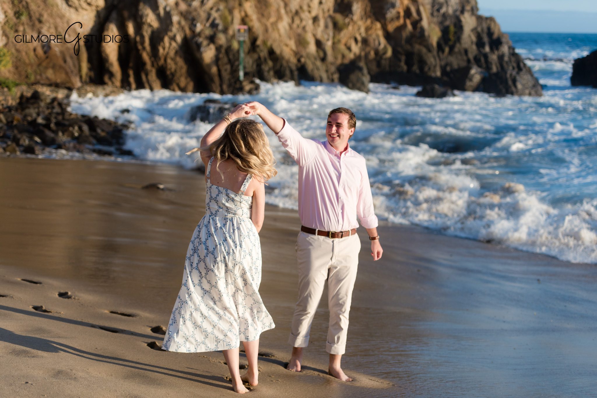 Groom holding bride-to-be after proposing at Emerald Bay in California
Romantic engagement portraits at Emerald Bay with ocean waves behind the couple