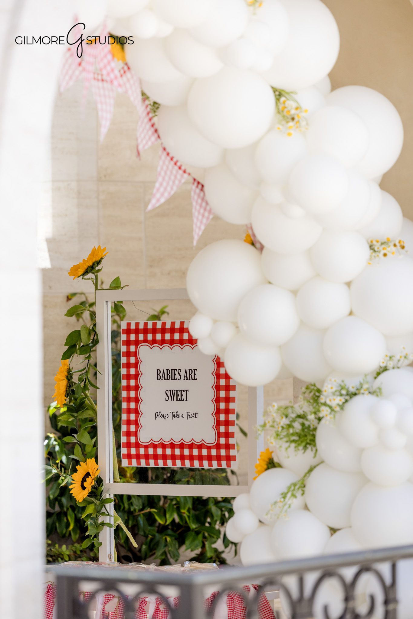 Newport Beach baby shower photography with lemonade stand and outdoor estate decor
Mom-to-be celebrating at a BabyQ themed baby shower in Newport Beach