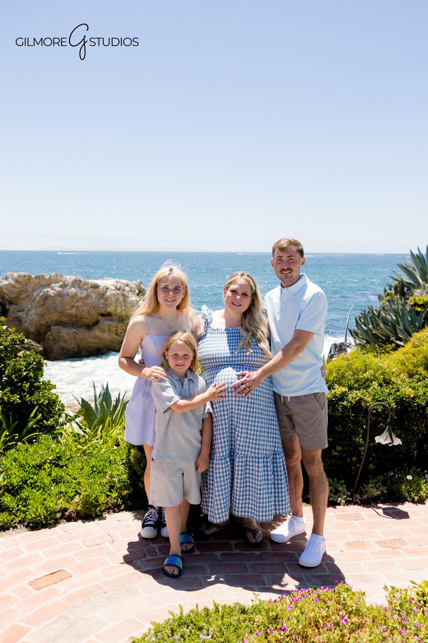 Family portraits during a baby shower at a Newport Beach private estate
Baby shower detail photography with florals, desserts, favors, and signage