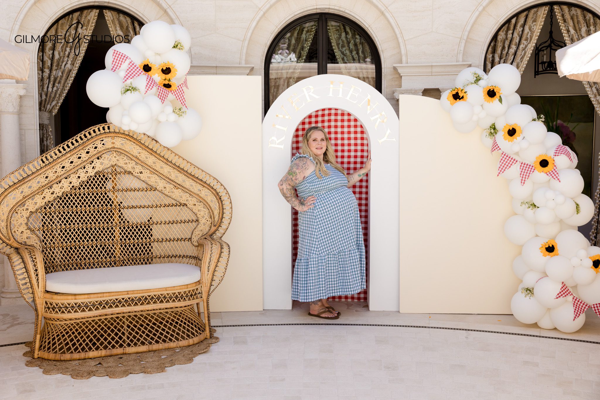 Orange County baby shower photography with sunflowers and custom event details
BabyQ baby shower table setup with gingham linens and floral centerpieces