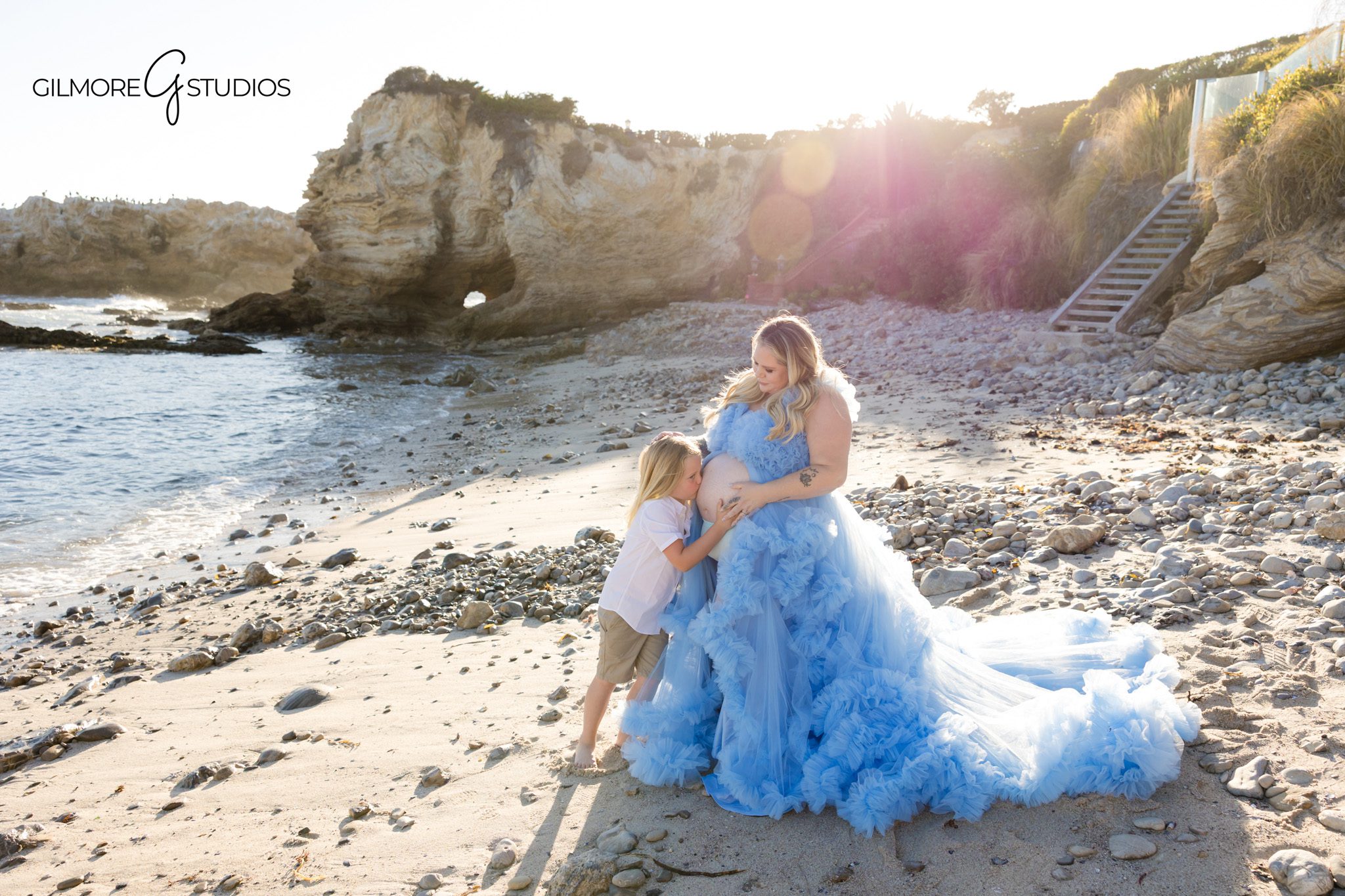 Maternity portrait on the sand during a private beach session in Newport Beach
Expecting parents walking along the shoreline during a Corona del Mar maternity session
