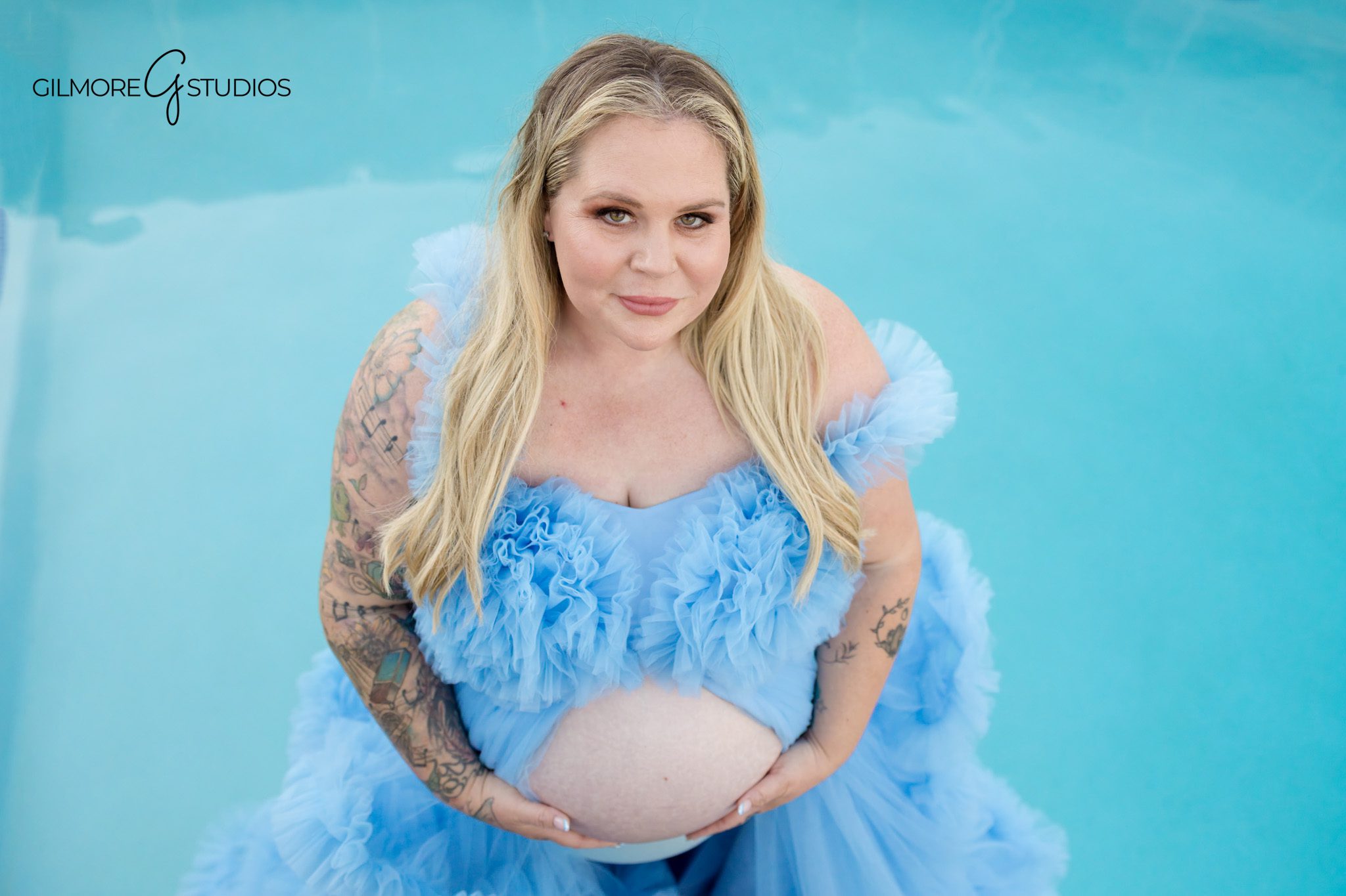Private beach maternity photos in Corona del Mar with soft sunset light
Expecting mother wearing a flowy dress during a Cameo Shores maternity session