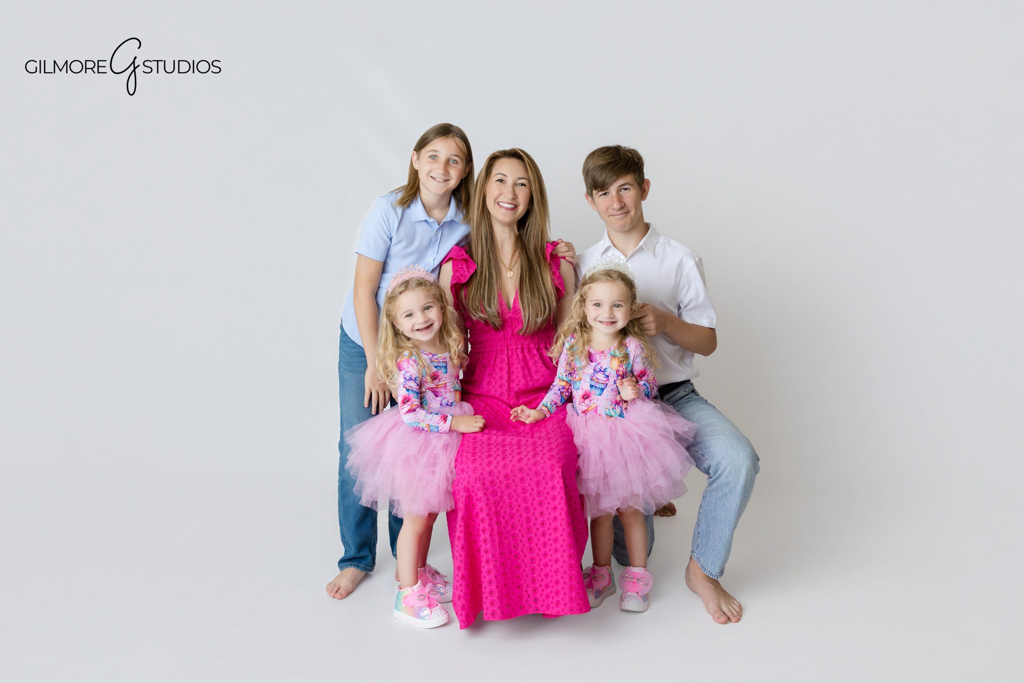 Twin girls cake smash portraits with matching unicorn birthday theme
Candid twin birthday photos during a unicorn themed studio session