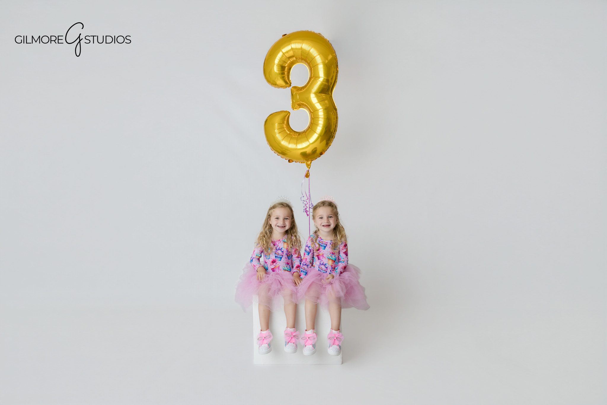 Orange County twin birthday photographer capturing pastel studio portraits
Twin girls in matching dresses during a Newport Beach birthday session