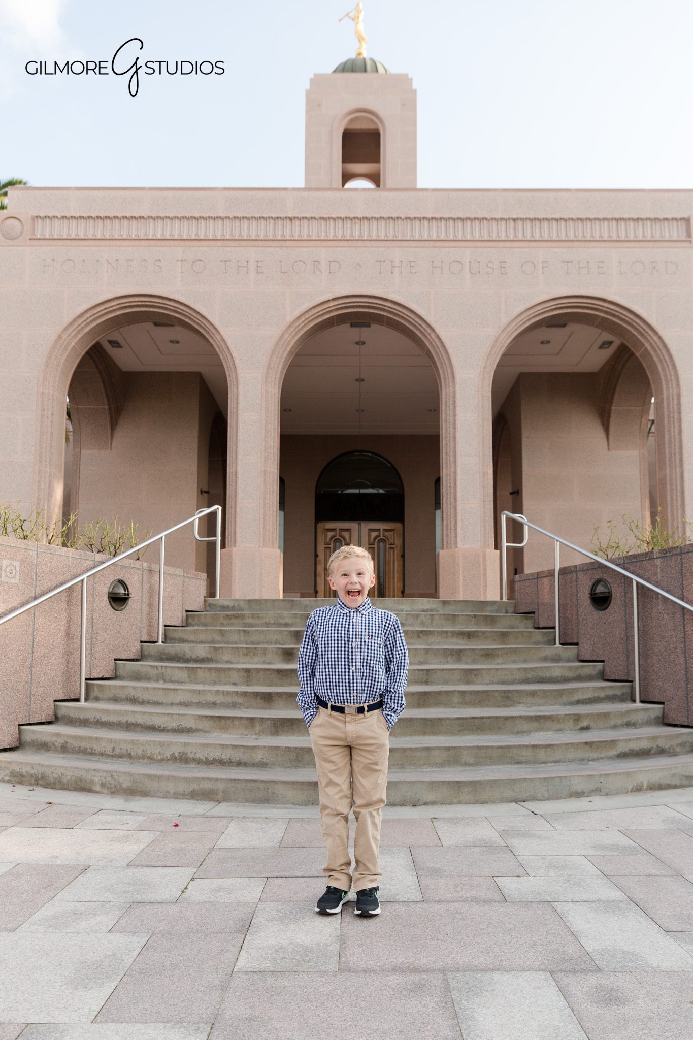Boy jumping near fountain during Newport Beach Temple baptism session
Playful LDS baptism photo at Newport Beach California Temple
