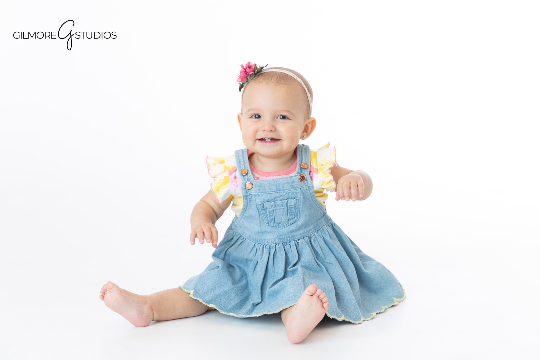 Baby sitting up milestone session with mom and dad family portraits
Gilmore Studios baby milestone session with family photos included