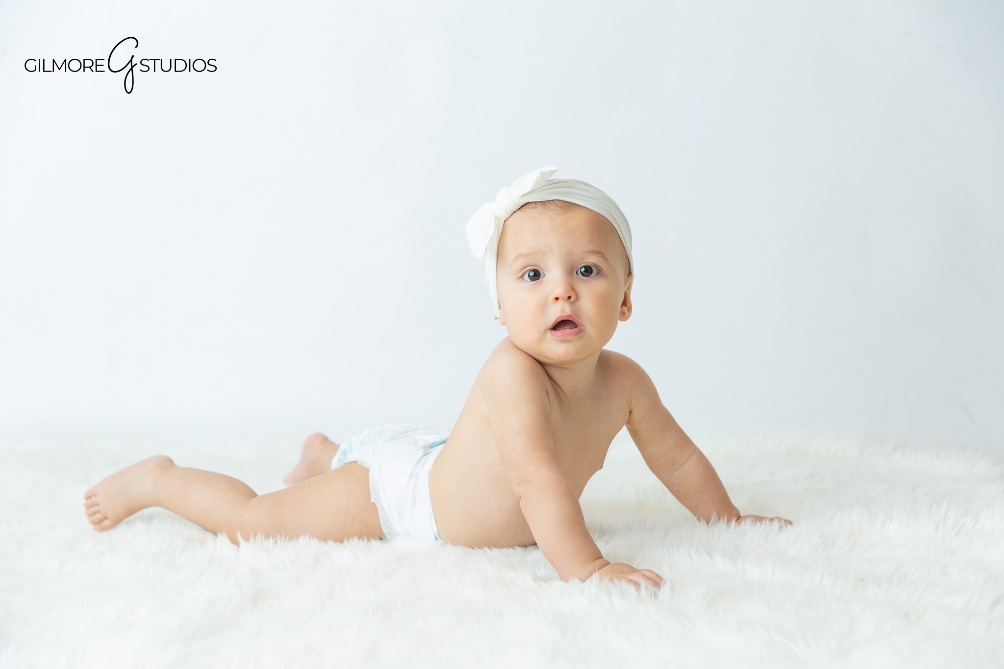 Baby milestone session with parents, sibling, and solo sitter portraits
Orange County family and baby photographer creating first year portraits