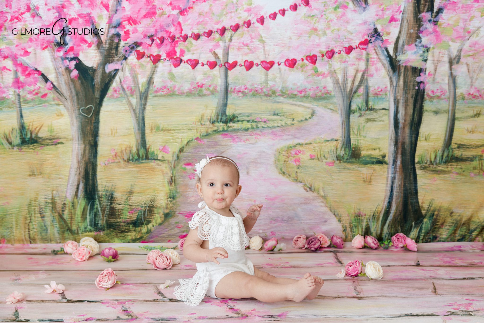Family photo with baby in the sitting up stage before crawling
Baby milestone portraits showing personality between newborn and first birthday