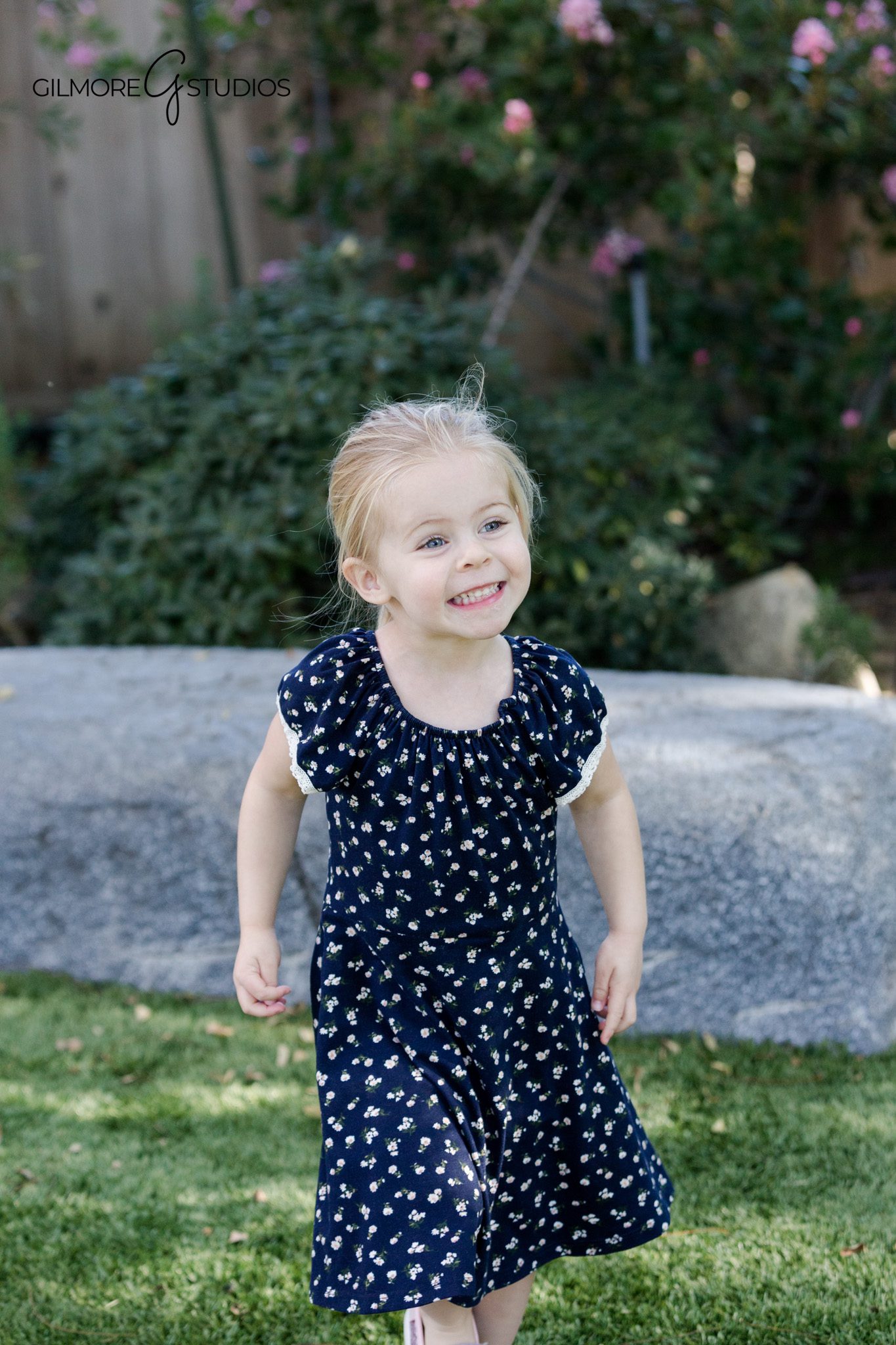 Garden family photos with kids running barefoot through the lawn
At-home family portraits with a personal backyard setting
