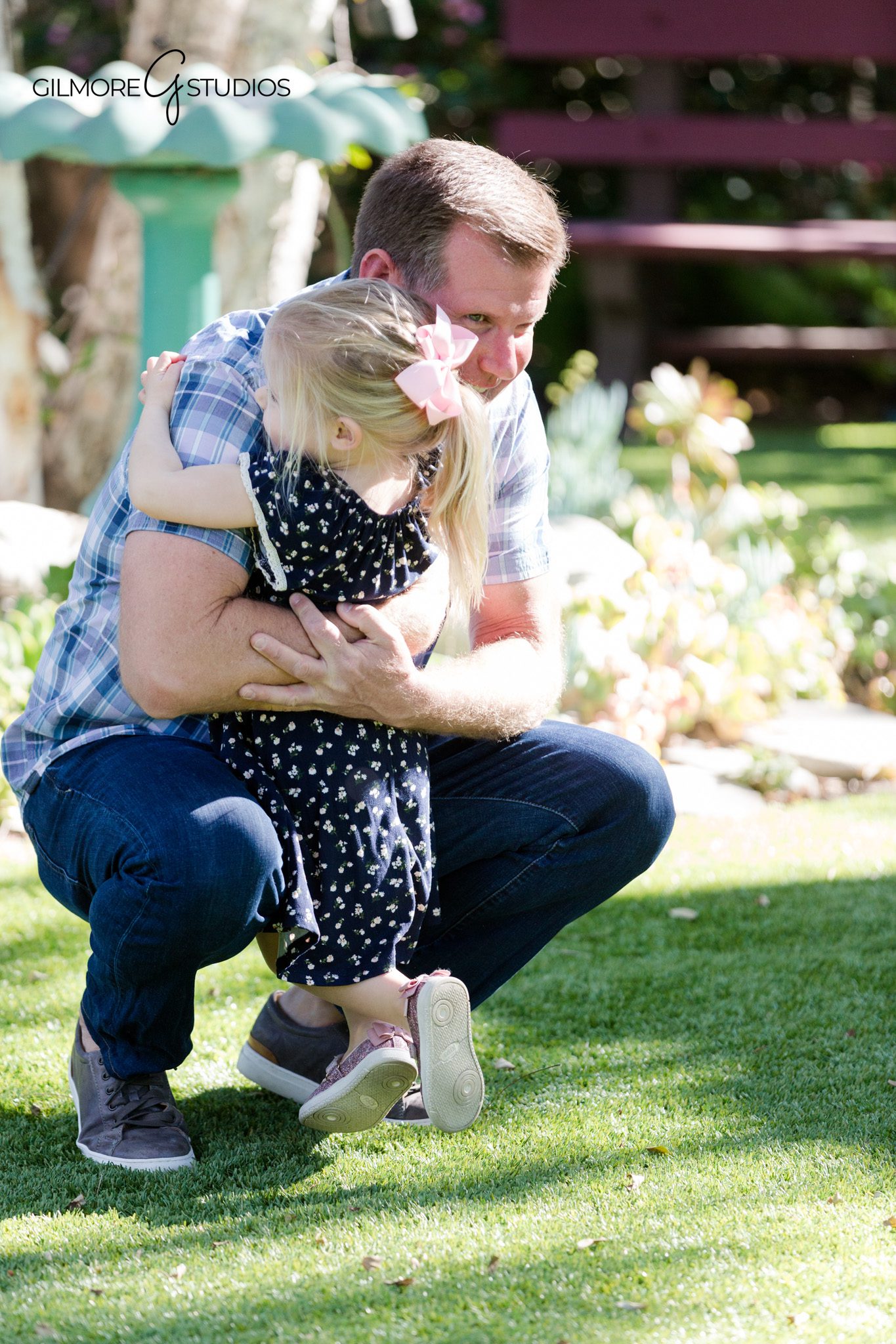 Family walking through a backyard garden during portrait session
Backyard family photos with young children feeling comfortable at home