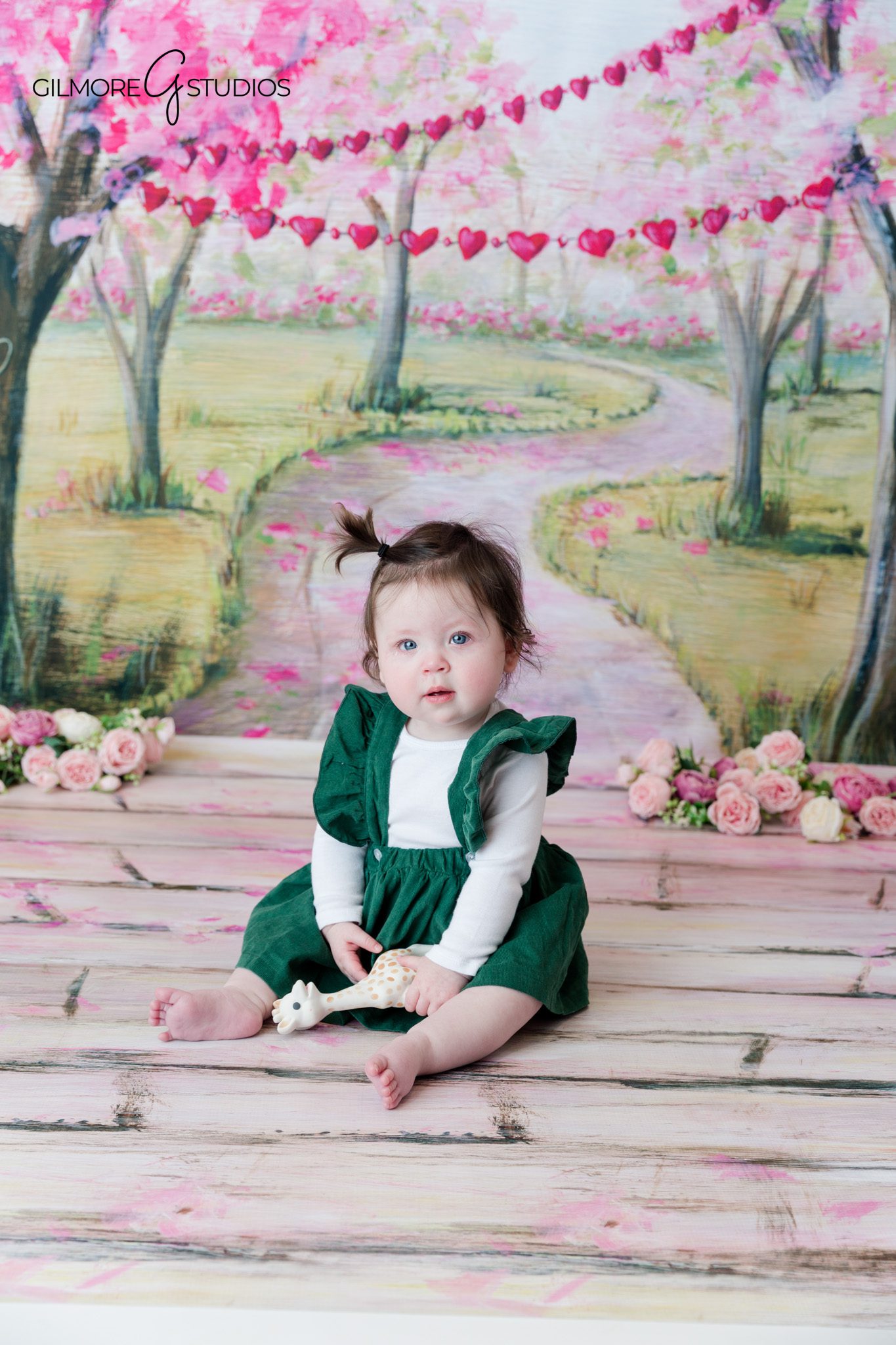 Baby girl sitting independently during studio milestone photos
Six month baby photos with simple neutral studio styling