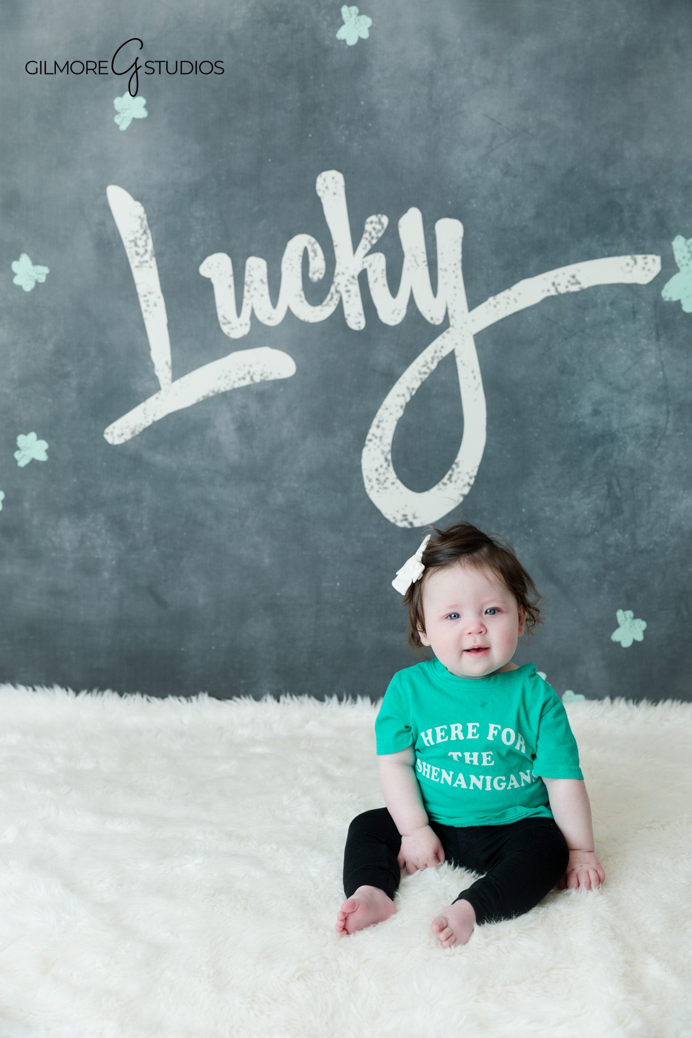 Baby sitting up on soft backdrop during milestone portrait session
Newport Beach baby photographer capturing sitting up milestone photos