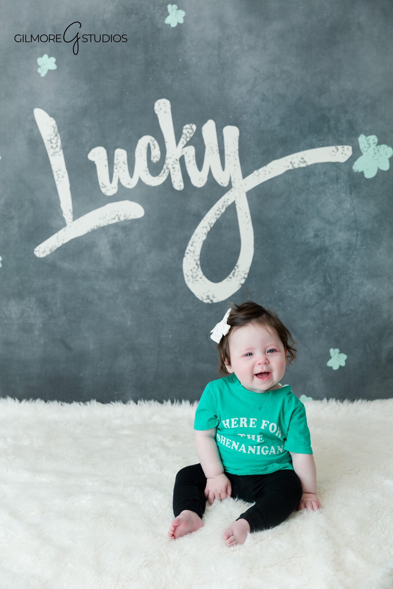 Baby milestone photos with wide eyes and natural personality
Studio baby portraits with simple timeless milestone styling