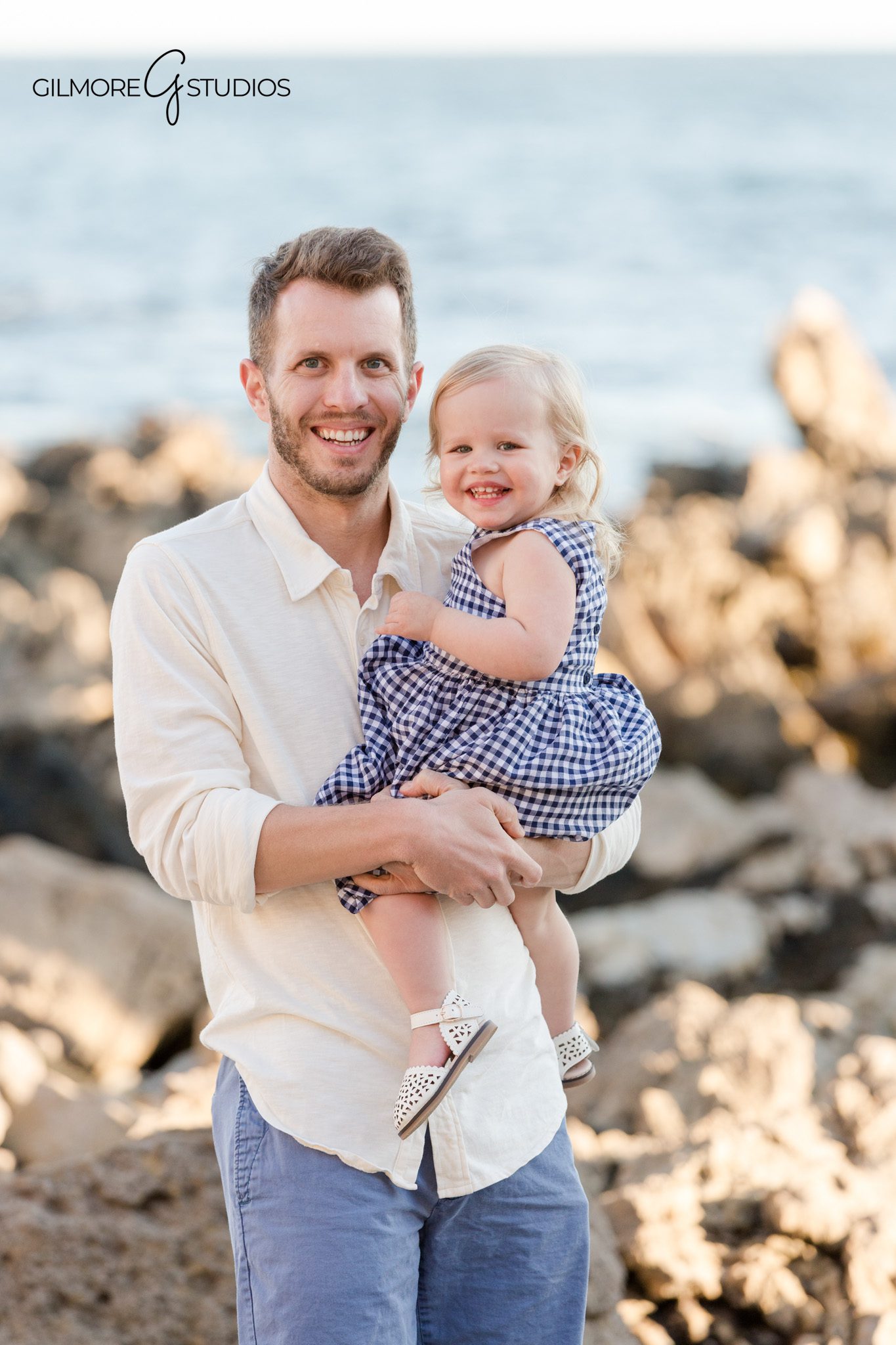 Extended family session with individual households photographed along the coast
Three-generation family portrait at Newport Beach during golden hour