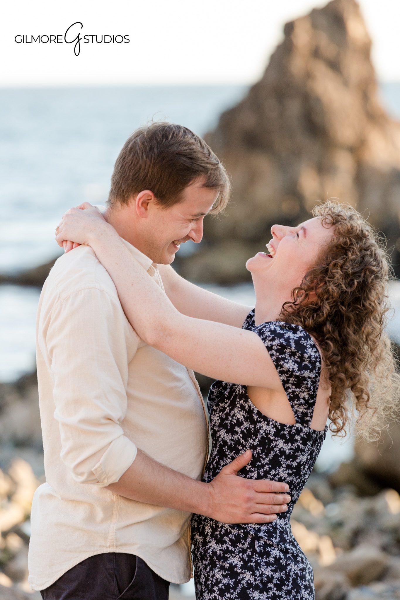 Newport Beach extended family session with ocean views and rocky coastline
Grandparents walking with grandchild during extended family beach photos