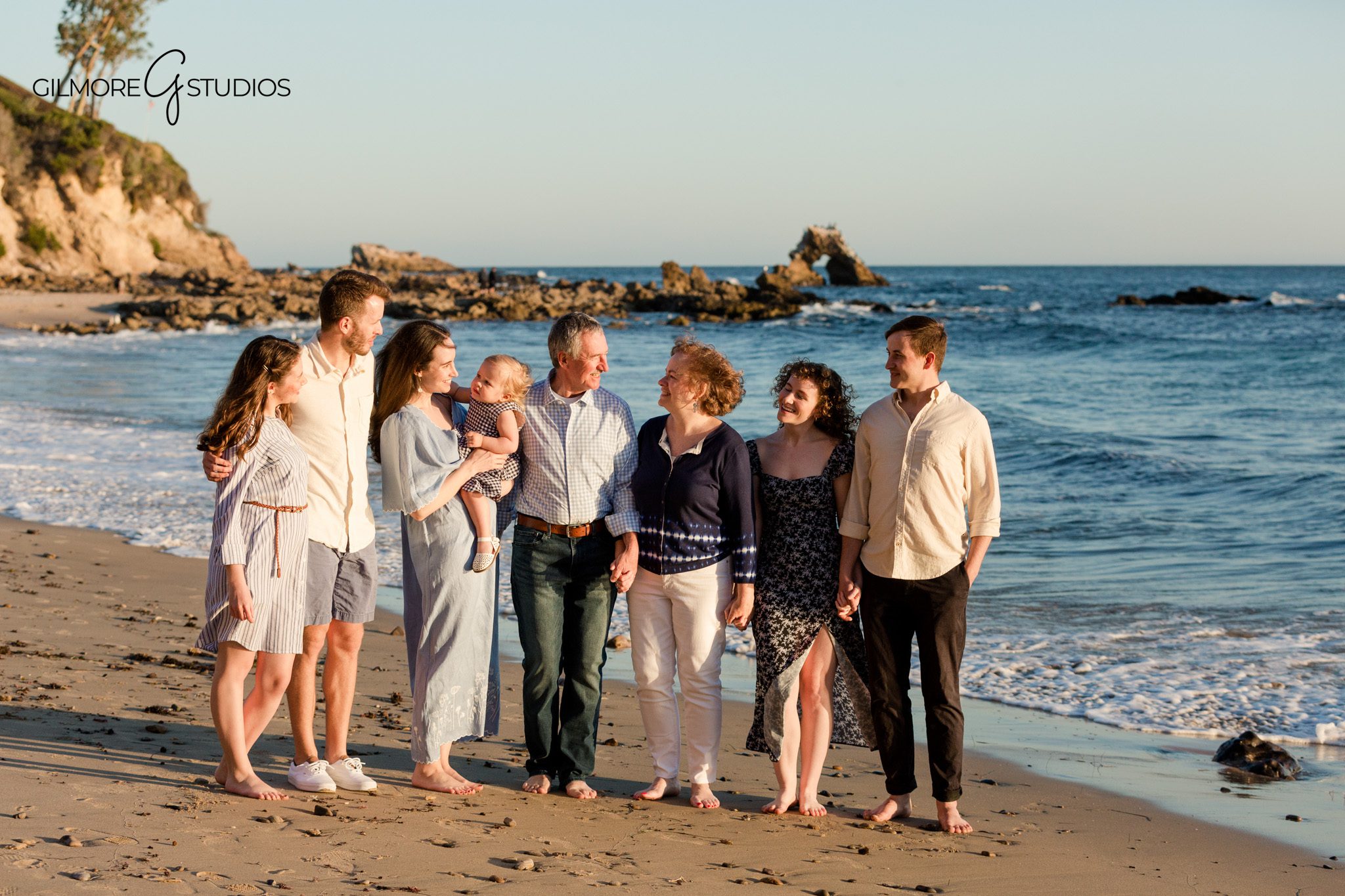 Family reunion beach photos with cousins walking along the shoreline
Extended family photos on the rocks with warm Southern California light