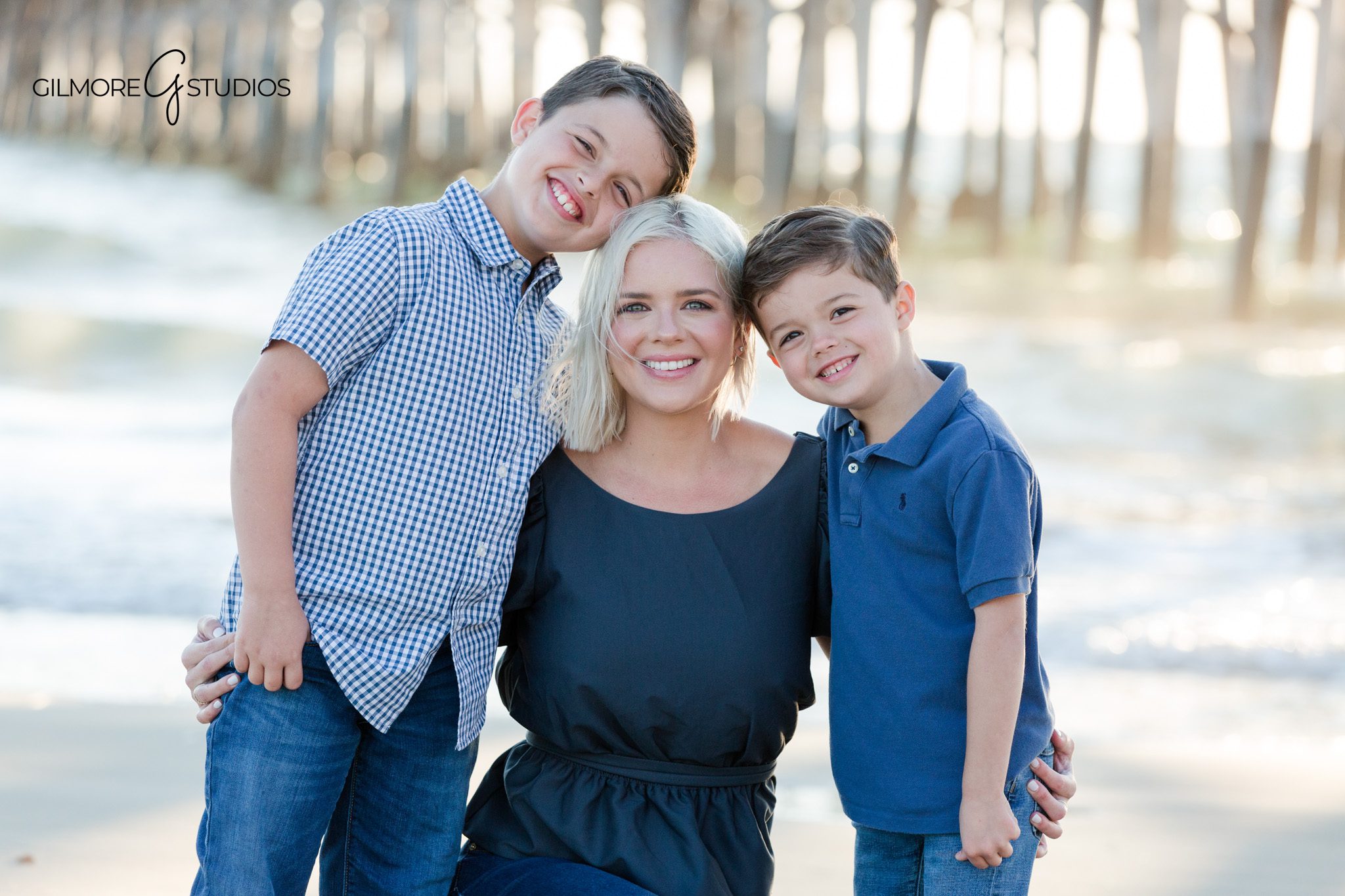 Newport Beach beach family session with relaxed natural posing
Sibling portraits under the Newport Pier during family photo session