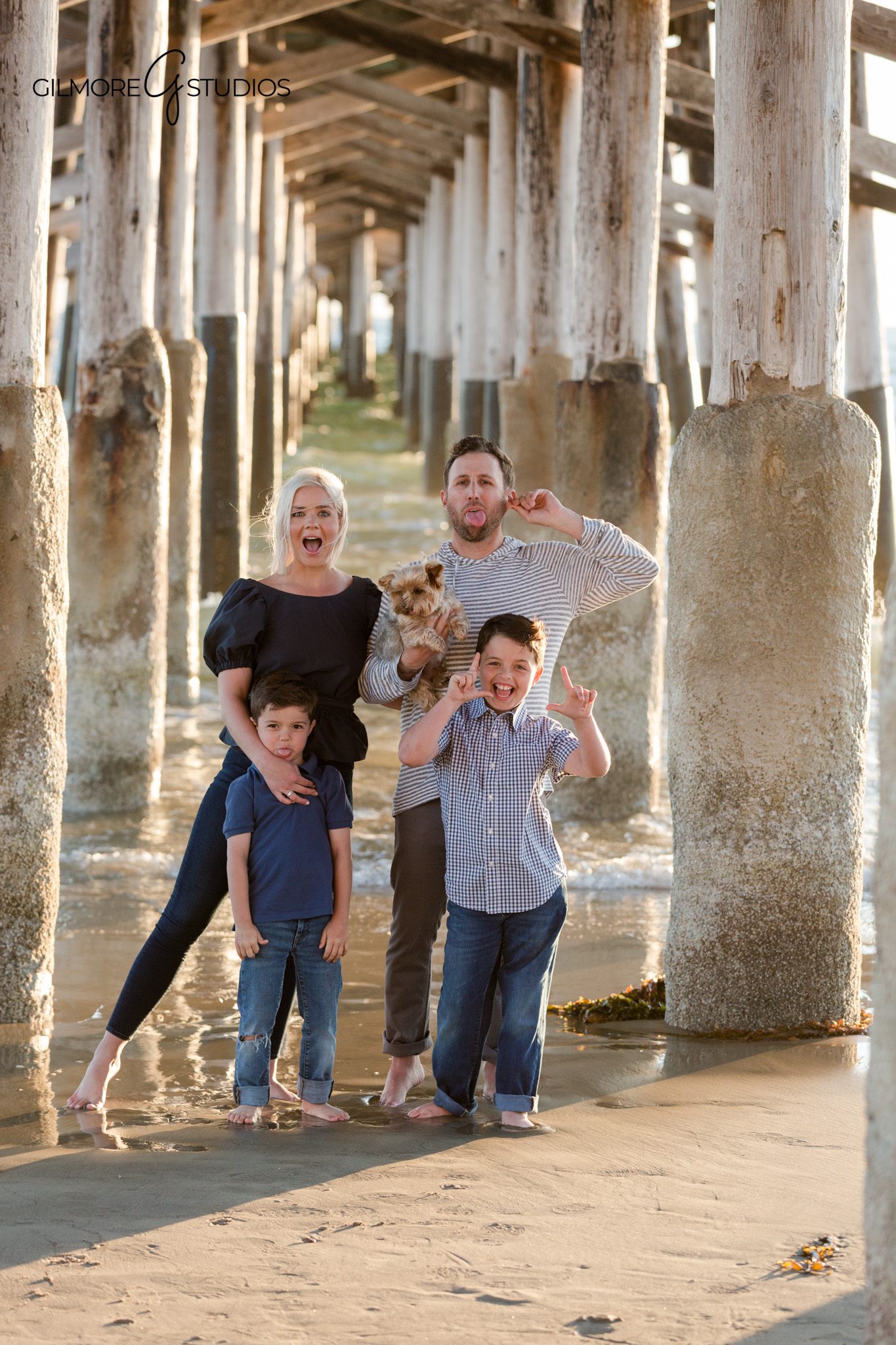 Golden hour family session under the Newport Pier in Orange County
Newport Beach family photographer capturing portraits under the pier