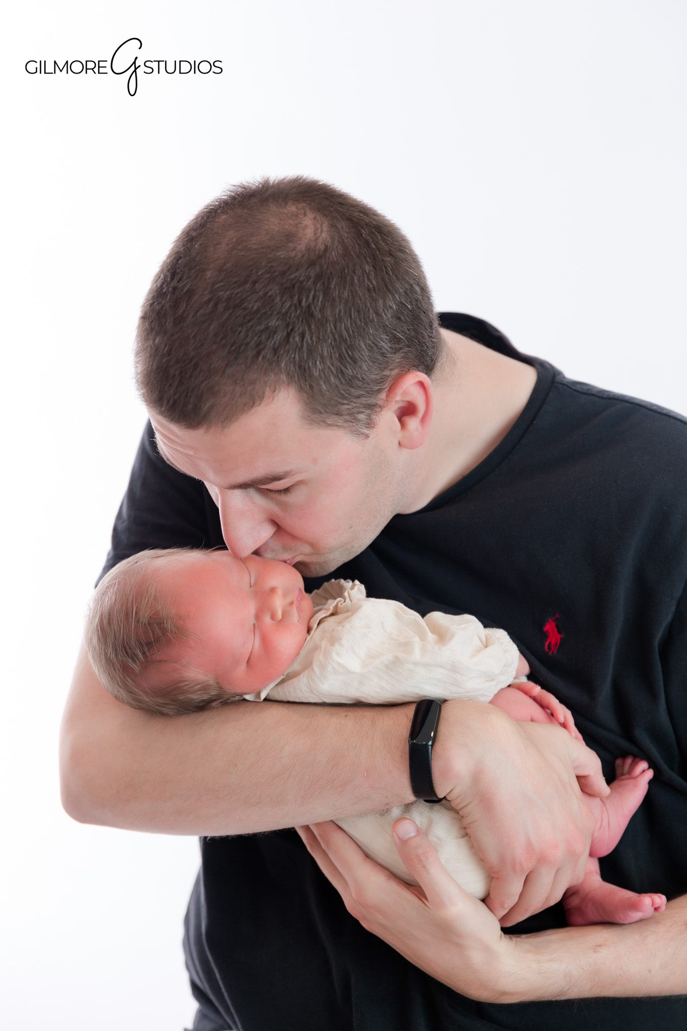 Bright white studio newborn photos for a Chandler AZ family
Parents smiling with their newborn baby during a Chandler studio session