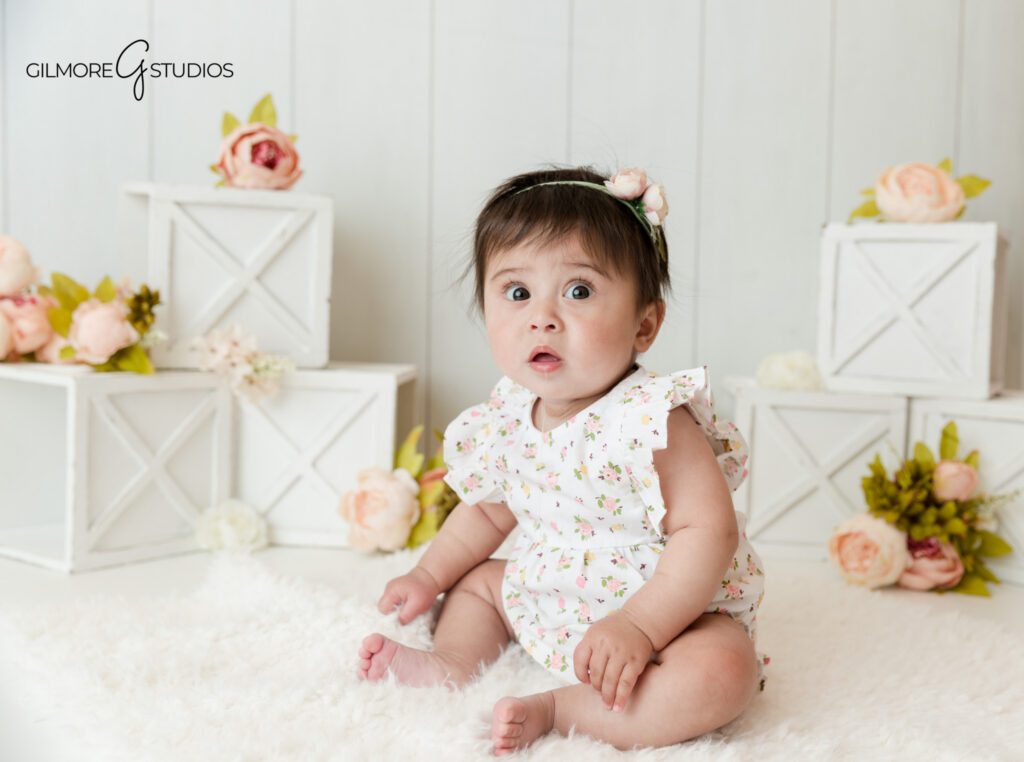 Gilbert AZ 6 month baby milestone photographer
Baby girl sitting up and smiling during milestone session