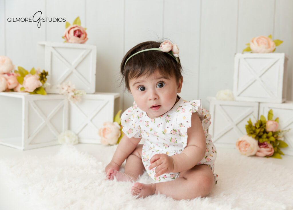 Simple studio sitter session for baby girl in Gilbert
Baby girl portrait with soft florals and clean white styling