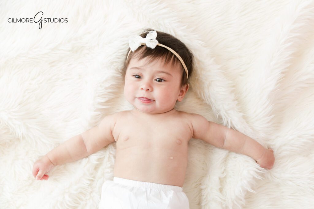 Baby milestone photography for growing babies in Gilbert AZ
Sitting up baby girl photos with timeless studio setup