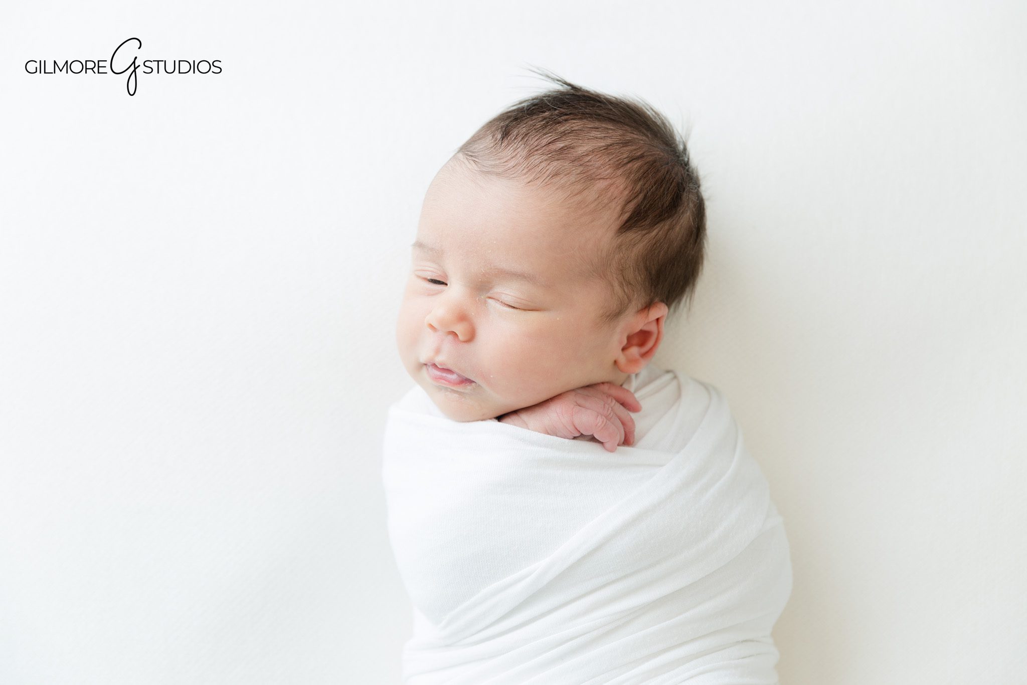 Baby girl resting in white fur during newborn studio photos
Simple baby led newborn pose for a Gilbert AZ newborn session