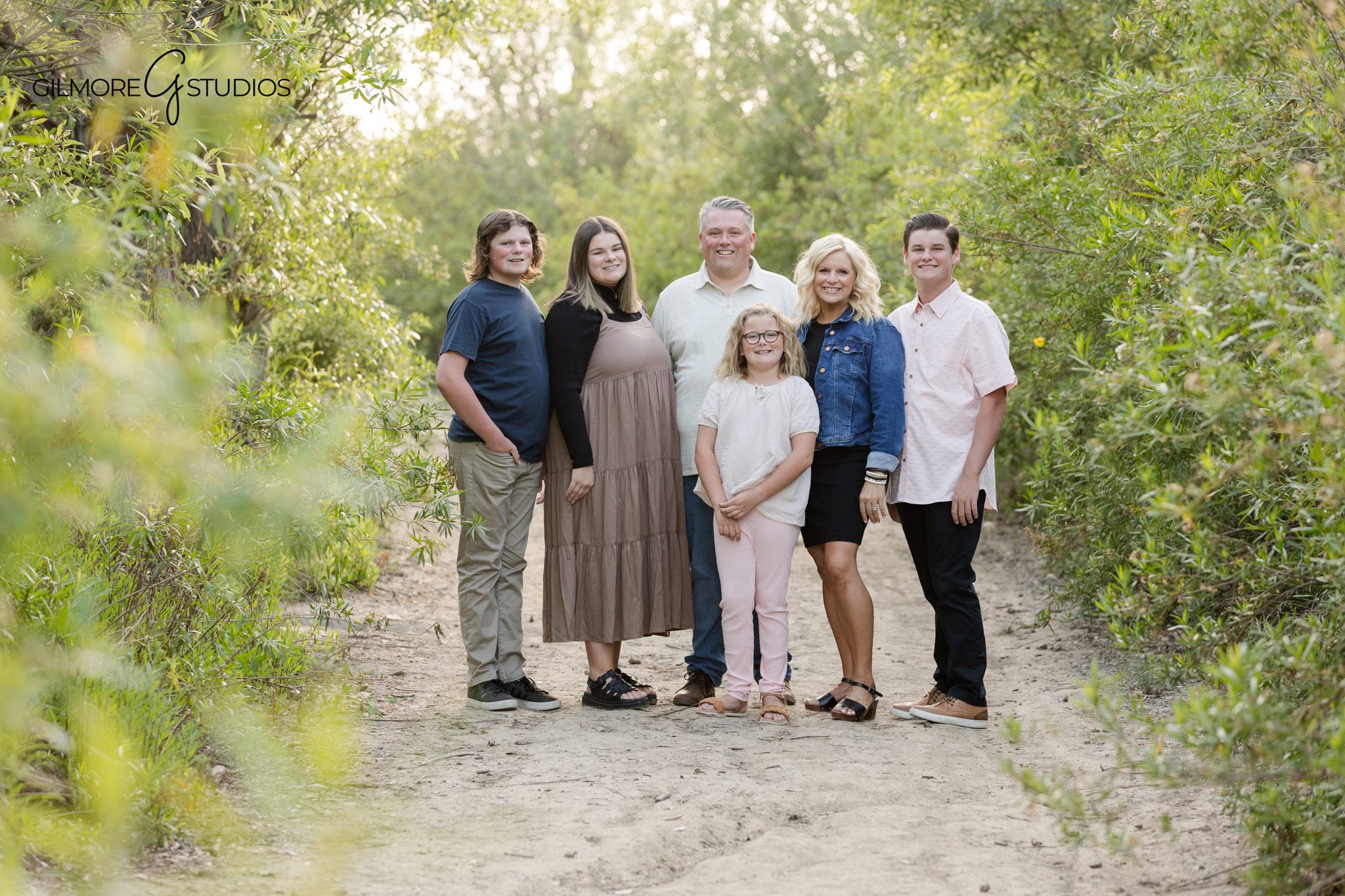 19th Street Park family session with coordinated neutral outfits
Newport Beach family photographer capturing candid sibling laughter