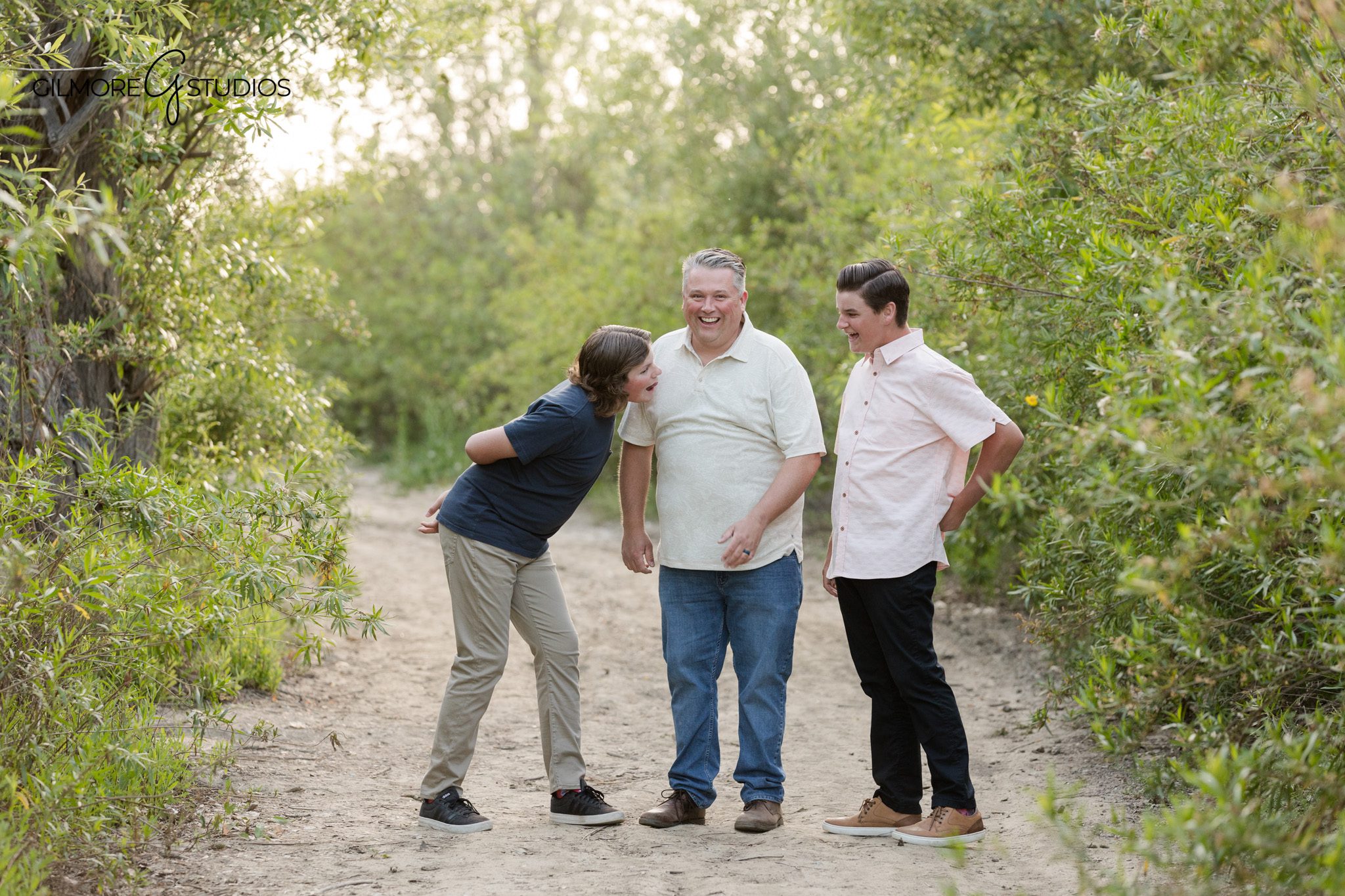 19th Street Park family photography with trails, trees, and warm light
Newport Beach family session with kids walking through the park