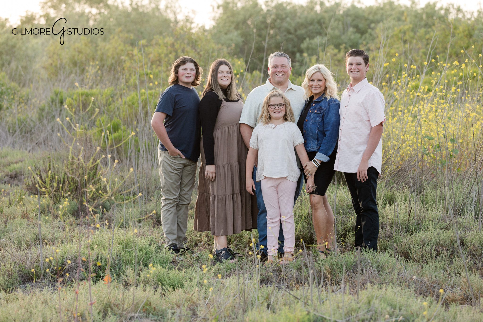 Family of six photographed at 19th Street Park in soft golden light
Parent and child portrait at 19th Street Park in Newport Beach