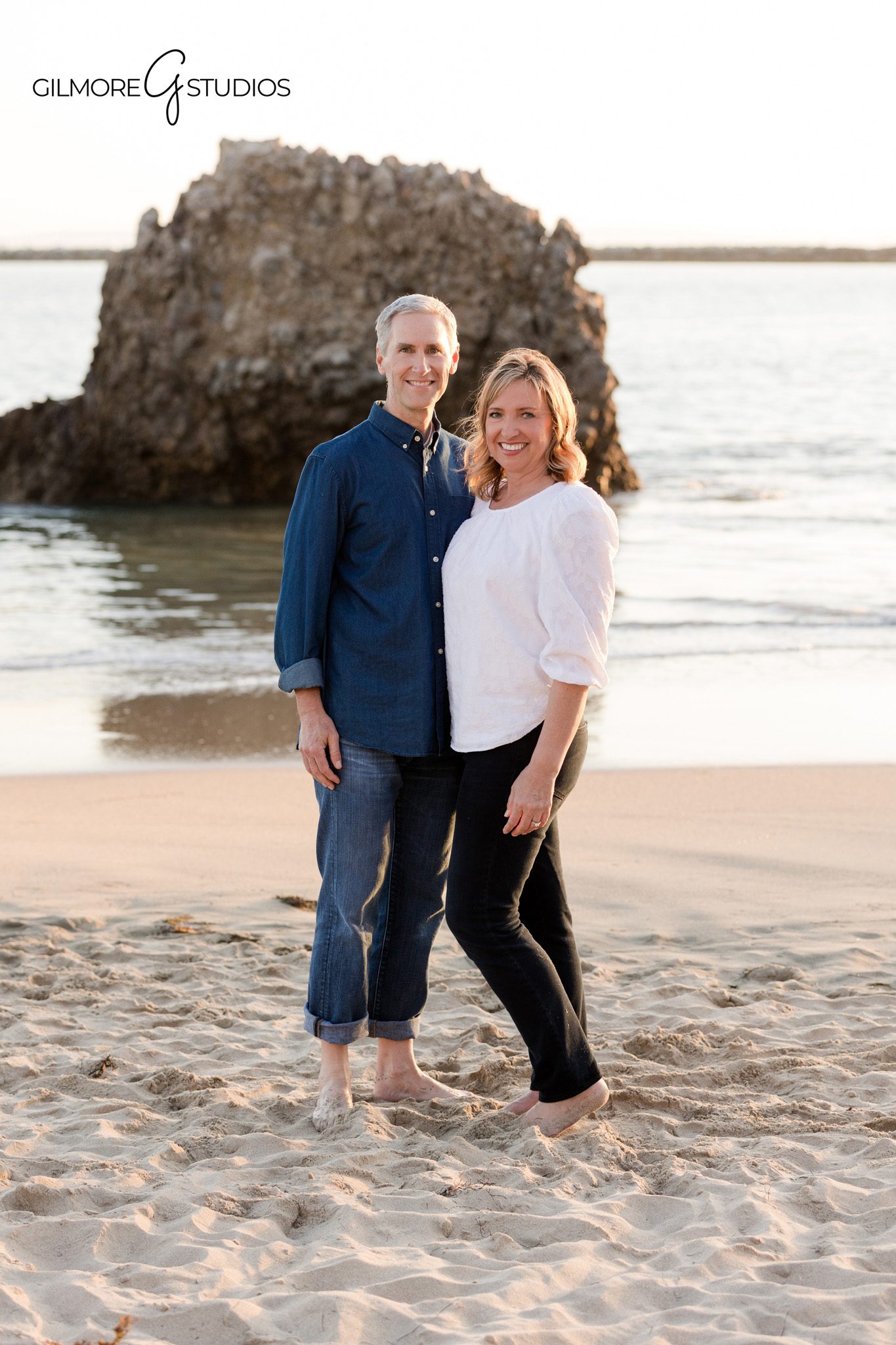 Family walking along the shoreline during Big Corona Beach photos
Corona del Mar beach family photos with soft sunset light