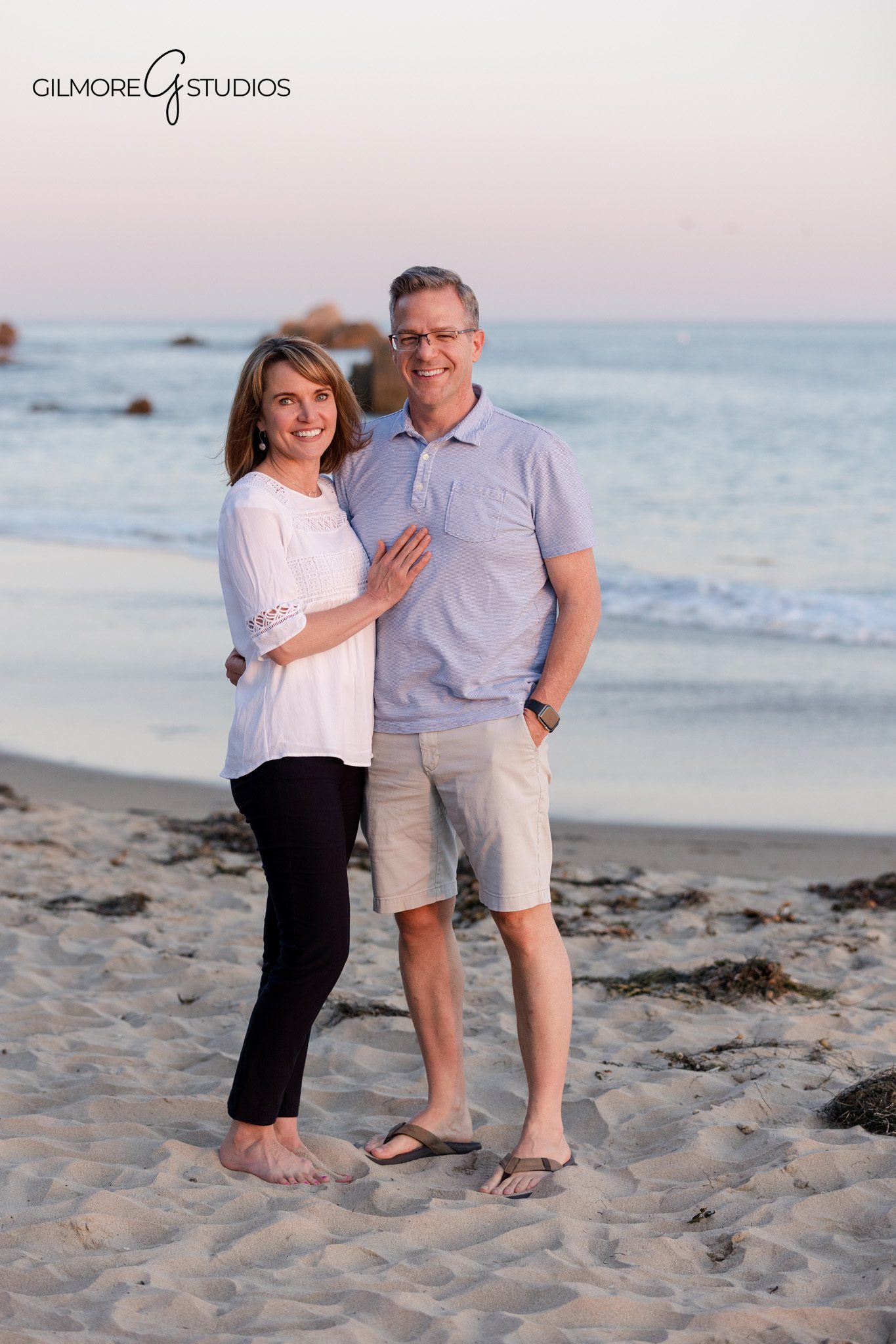 Family photos at Corona del Mar State Beach with warm golden hour light
Big Corona Beach extended family portraits with cliffs in the background