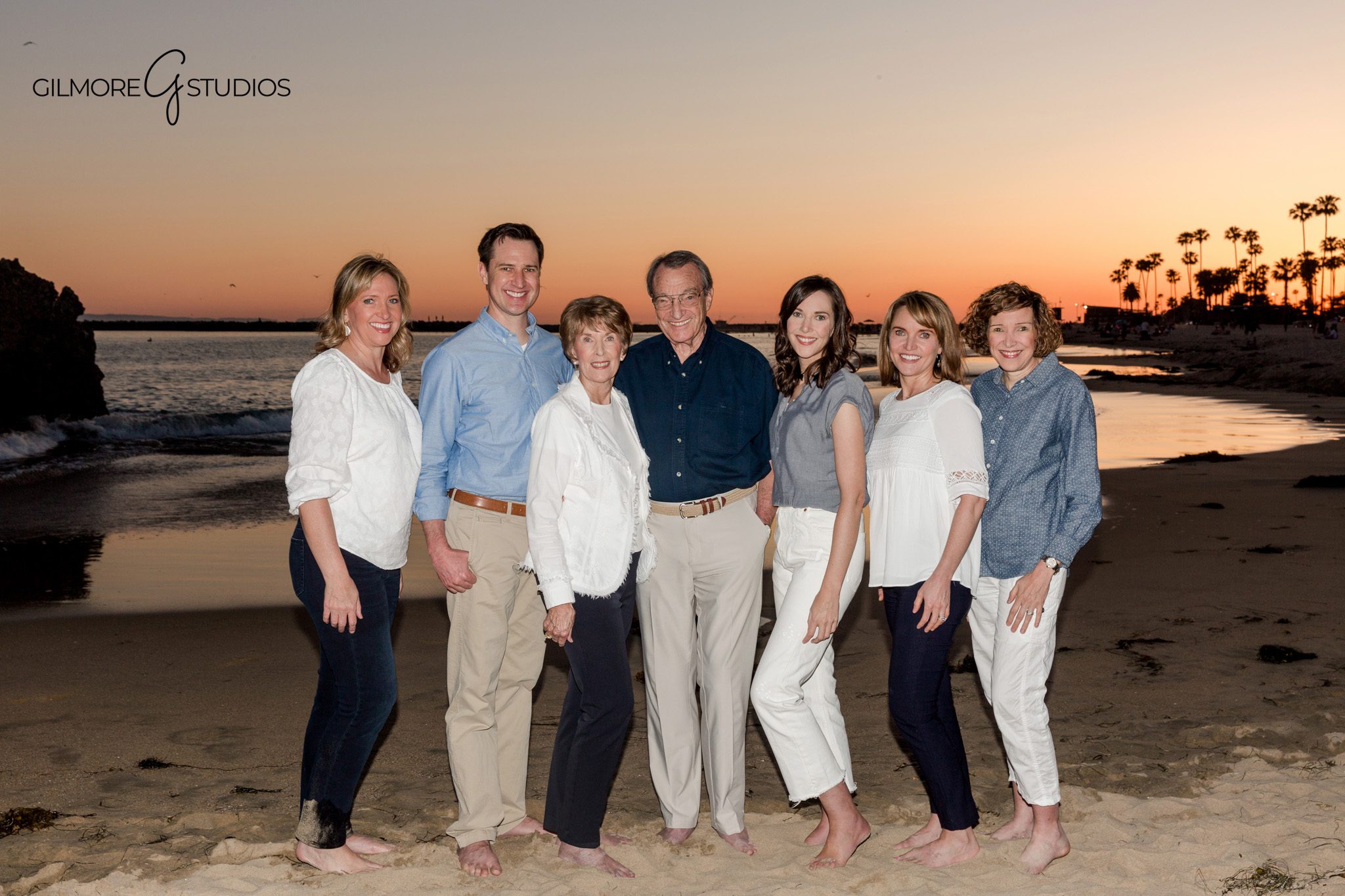Family photos with ocean waves and warm cliff light at Big Corona Beach
Multi-generational family silhouette at Big Corona Beach during blue hour