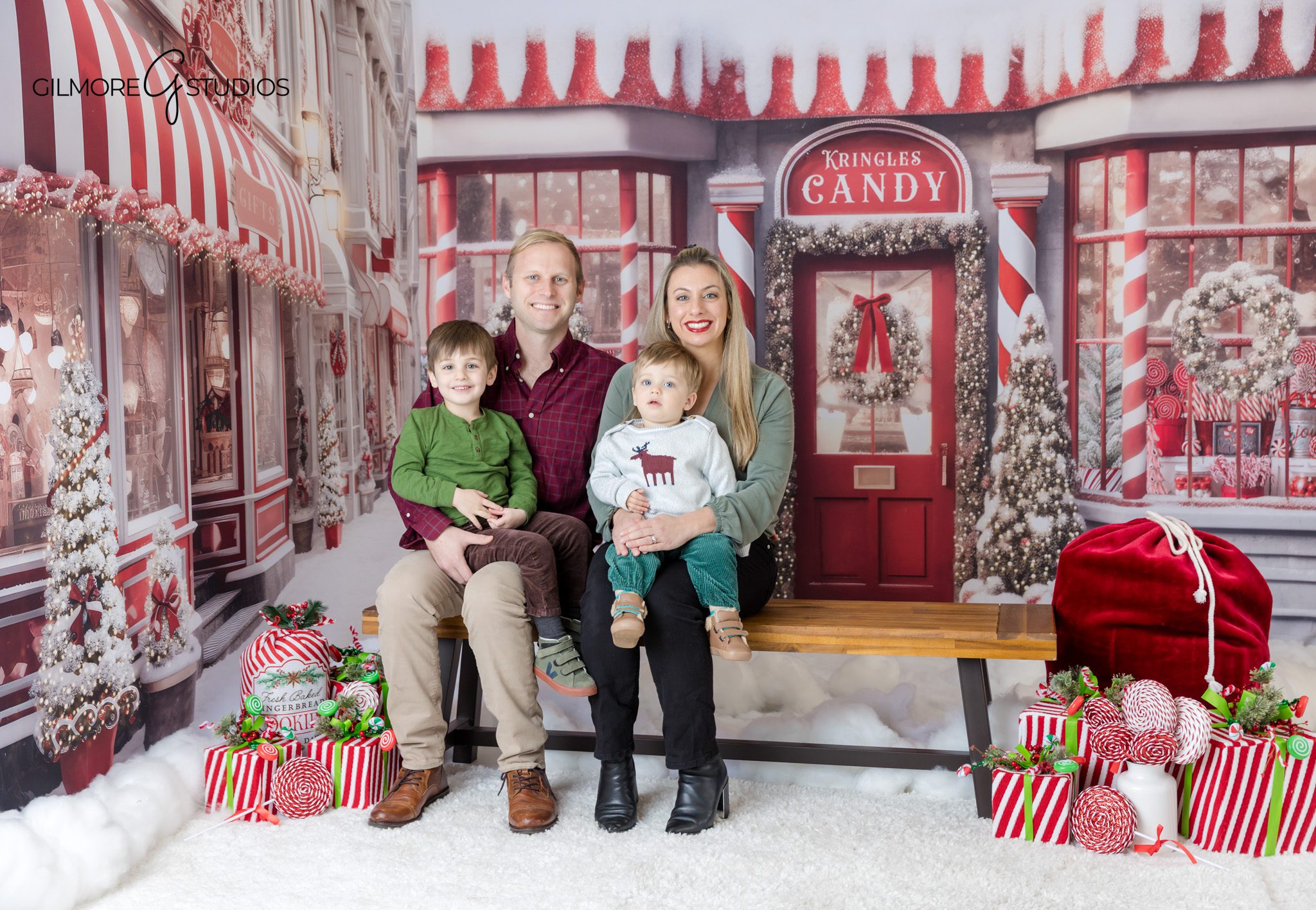 Child reading Christmas book with Santa in studio
Santa mini session with little girl and holiday book