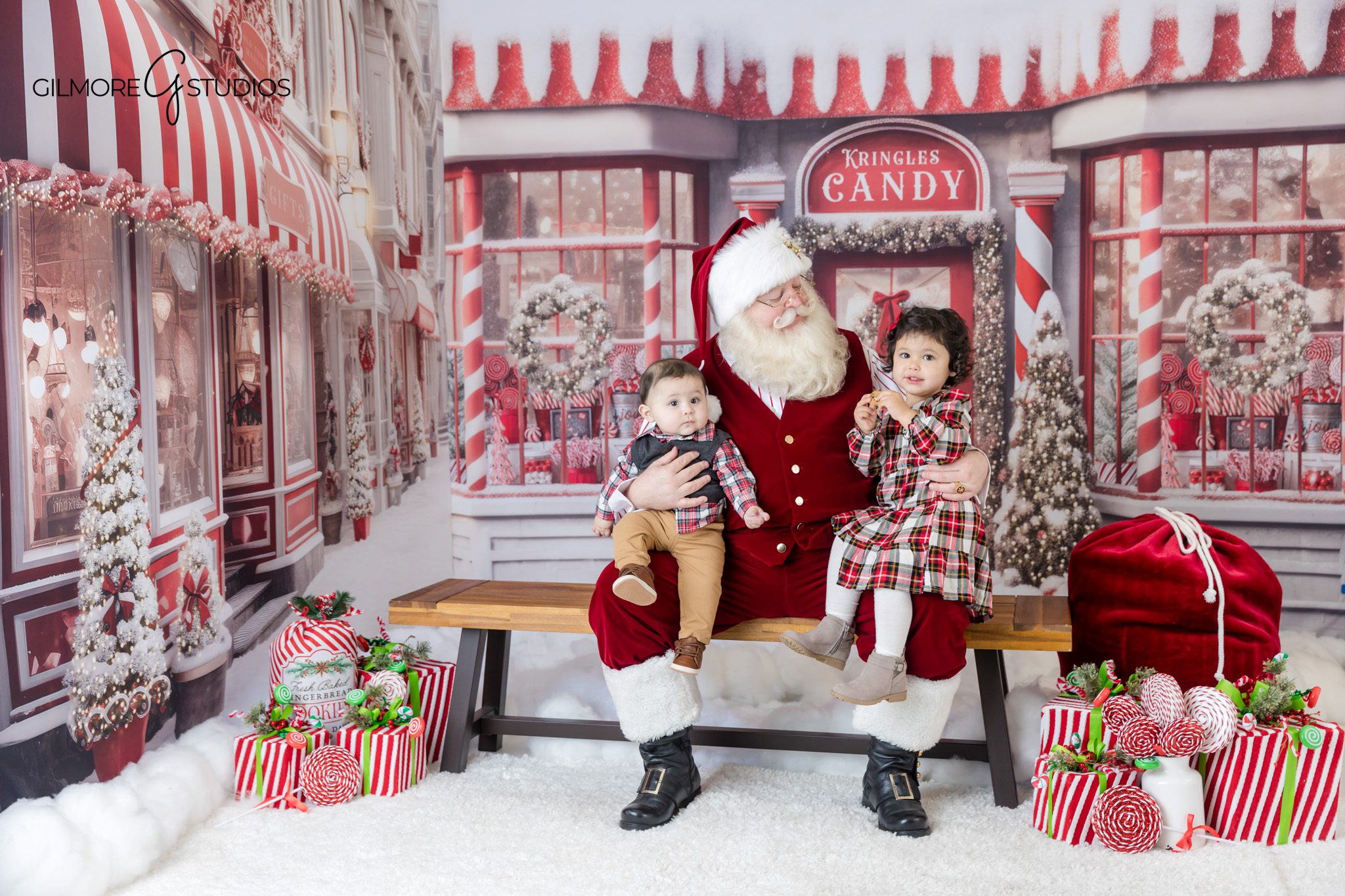 Santa reading with child during holiday mini session
Gilmore Studios Santa Experience with storybook moment
