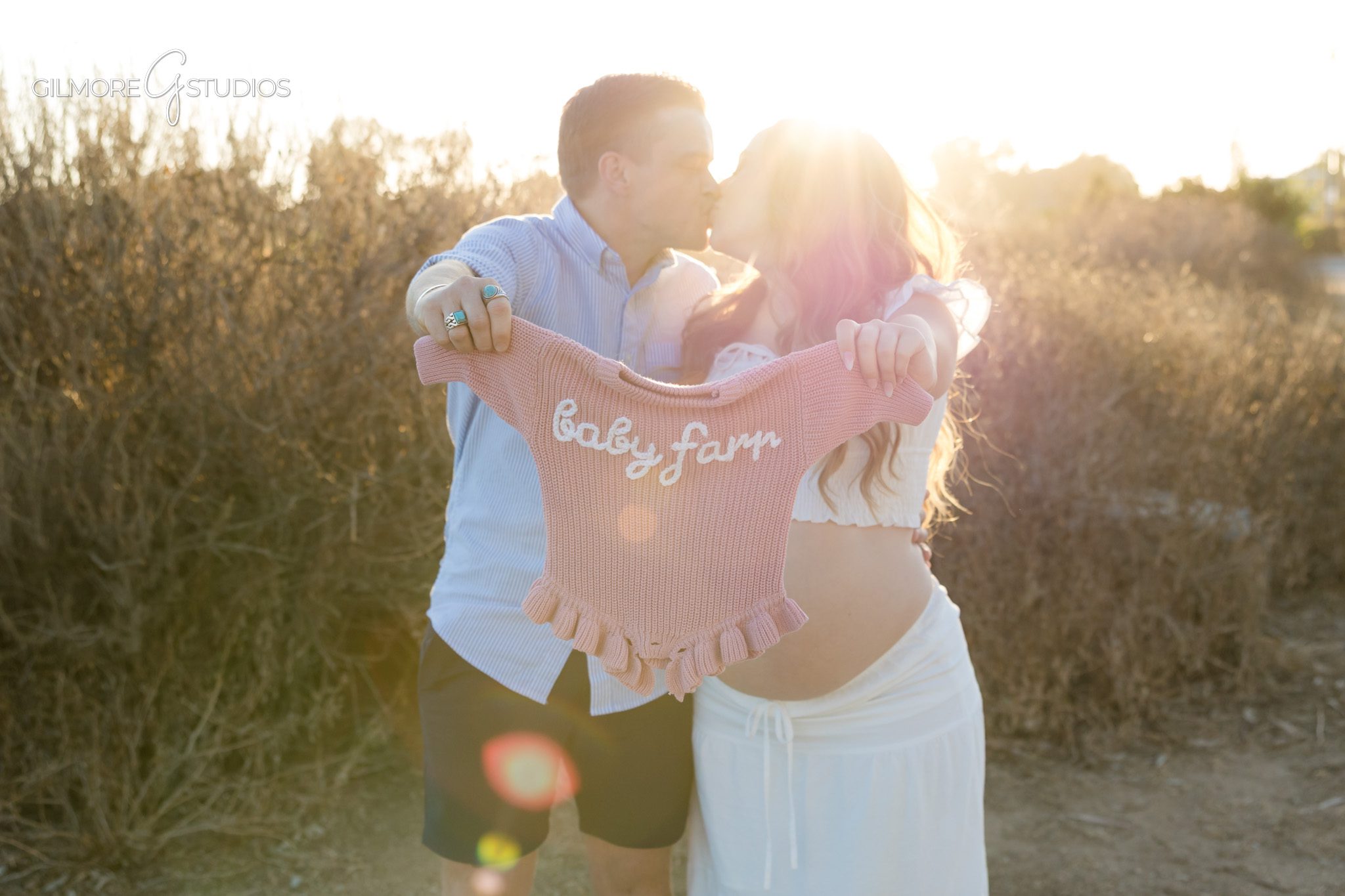 Surprise proposal at Newport Beach Back Bay with expecting parents
Couple holding ultrasound photo during maternity proposal session