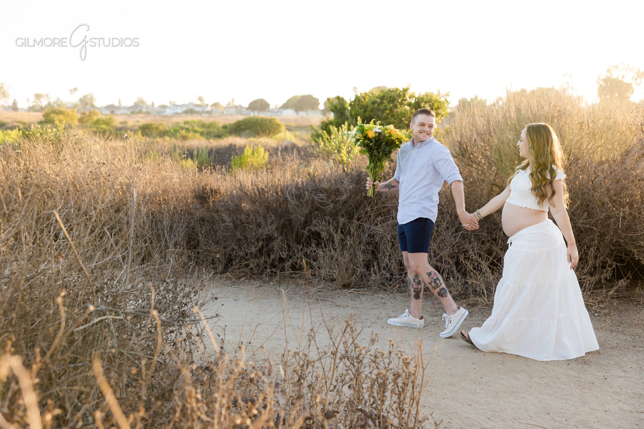 Newport Beach maternity proposal with eucalyptus trees and natural scenery
Couple celebrating pregnancy and engagement during one Newport Beach photo session