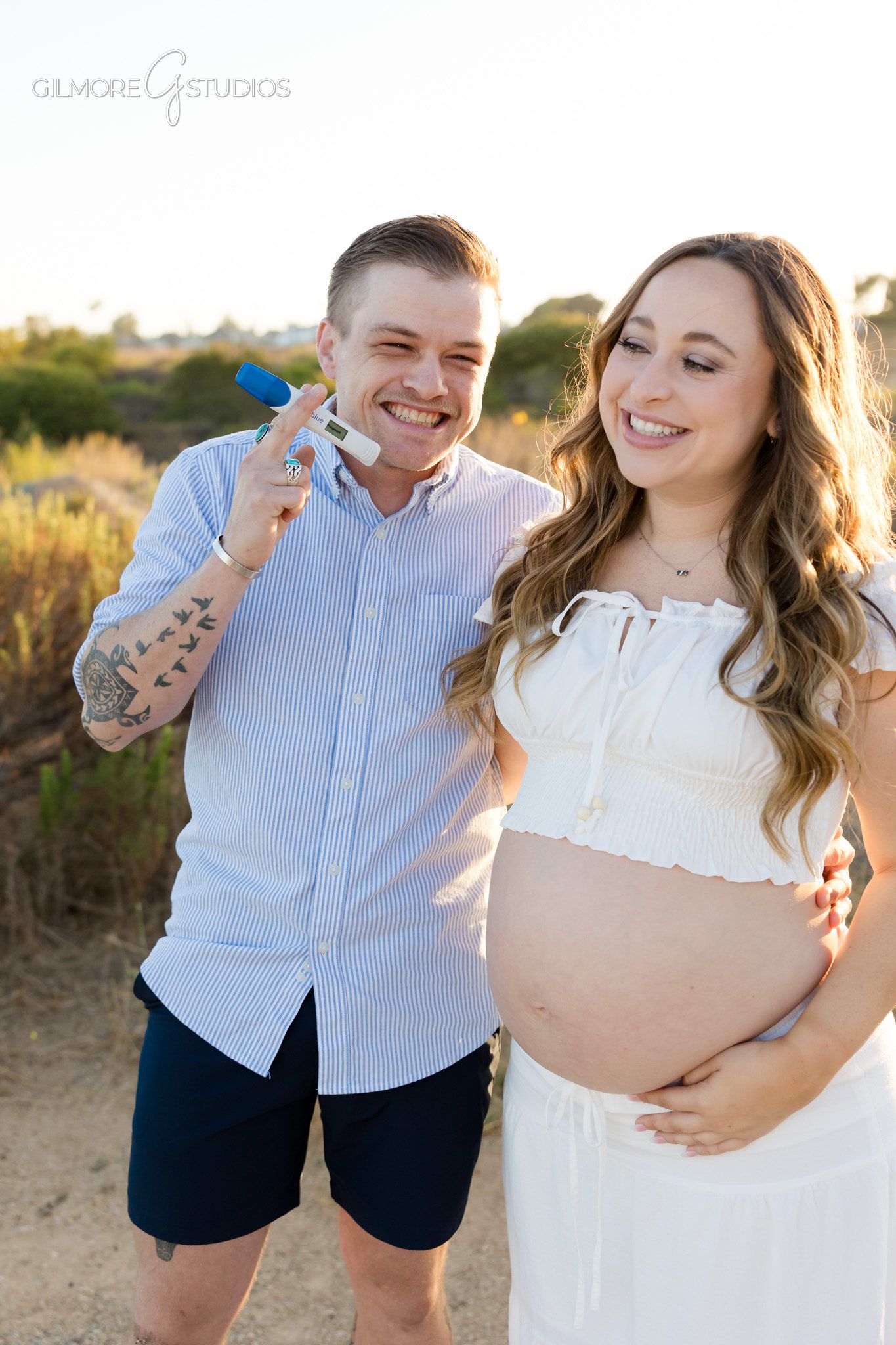 Engagement ring closeup during surprise maternity proposal in Newport Beach
Newport Beach Back Bay proposal with expecting parents at golden hour